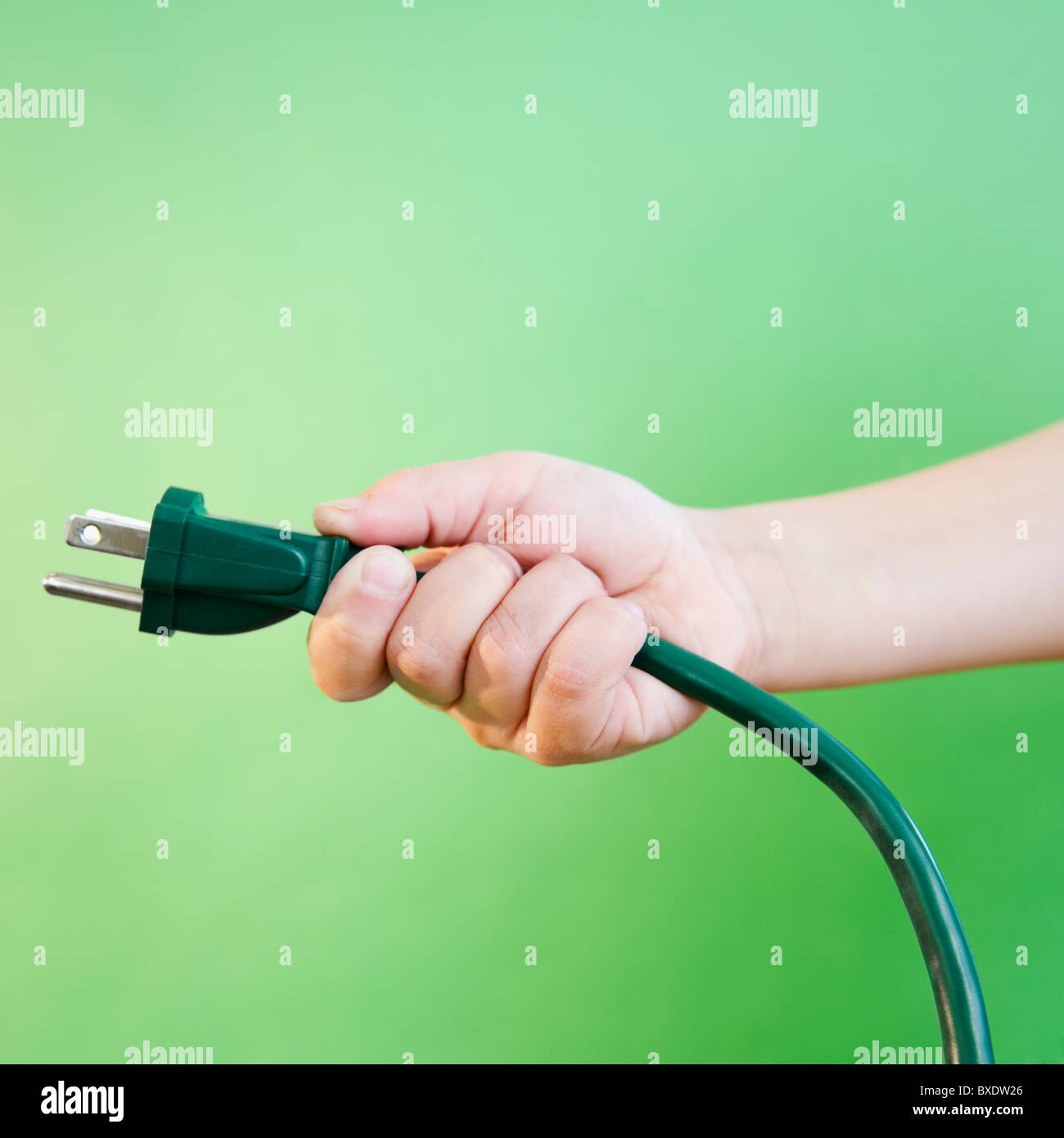 Hand holding electrical cord Stock Photo Alamy