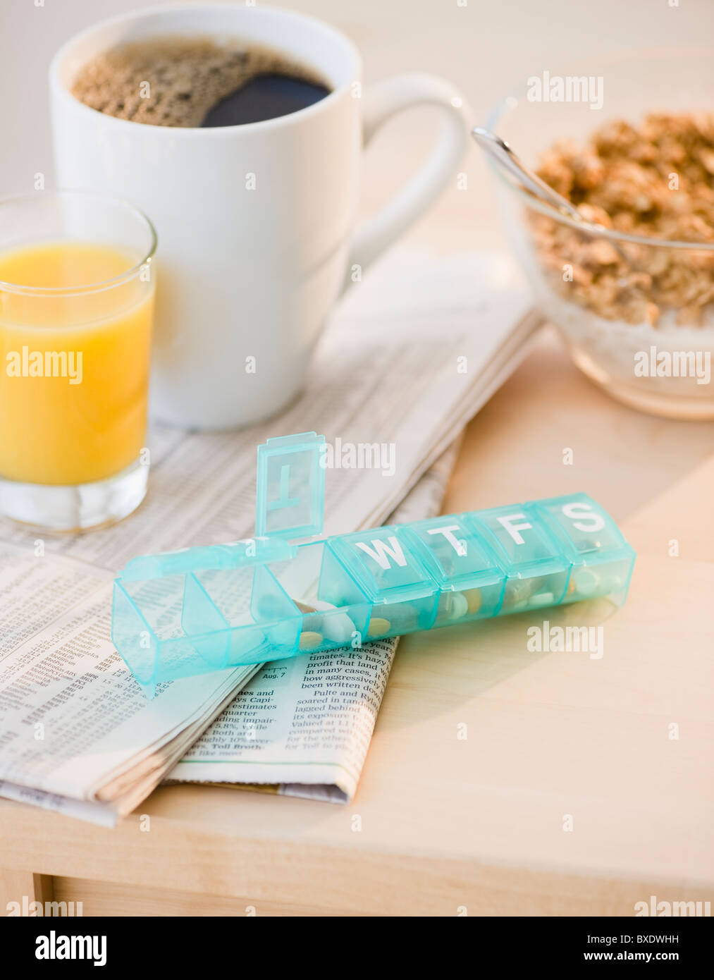 Prescription pills on breakfast table Stock Photo