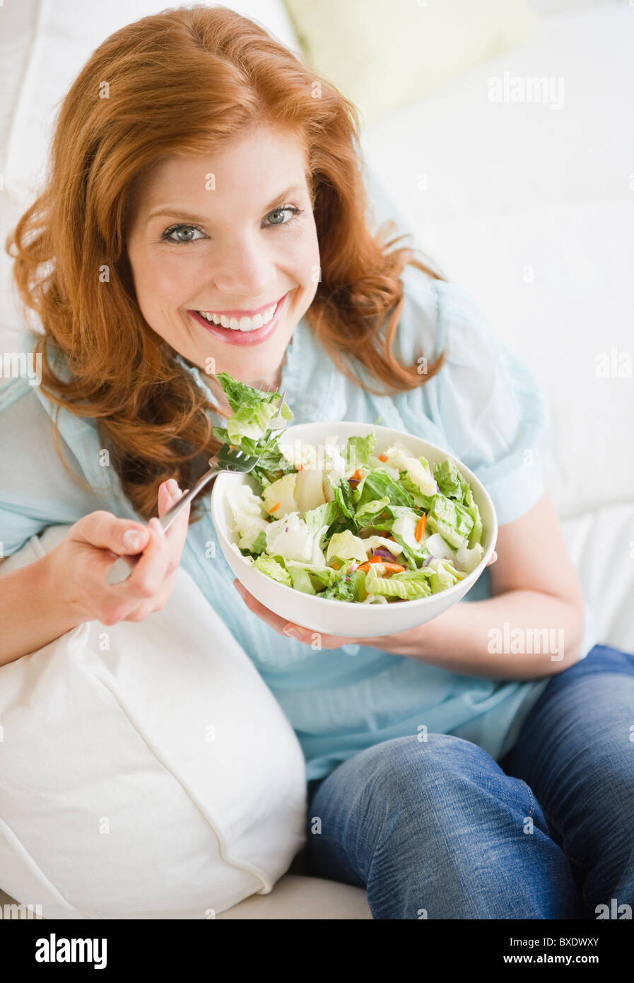 Woman eating salad Stock Photo