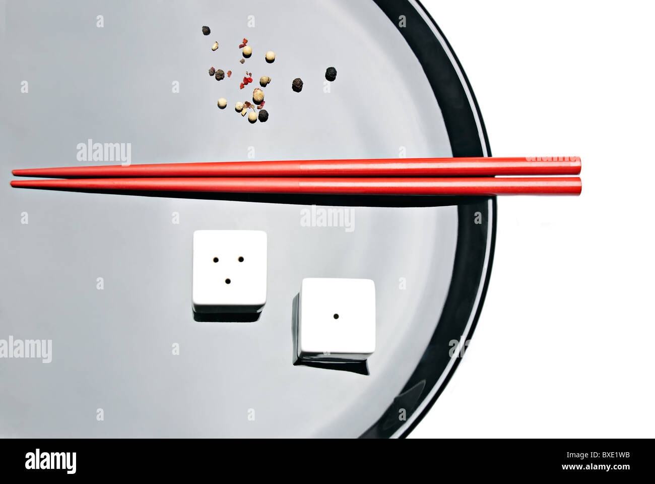 Food composition with chopsticks, salt and pepper Stock Photo