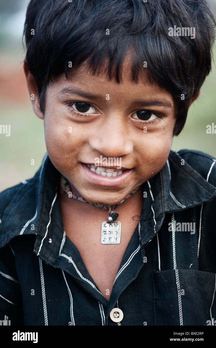 Young poor lower caste Indian street boy smiling. Andhra Pradesh, India