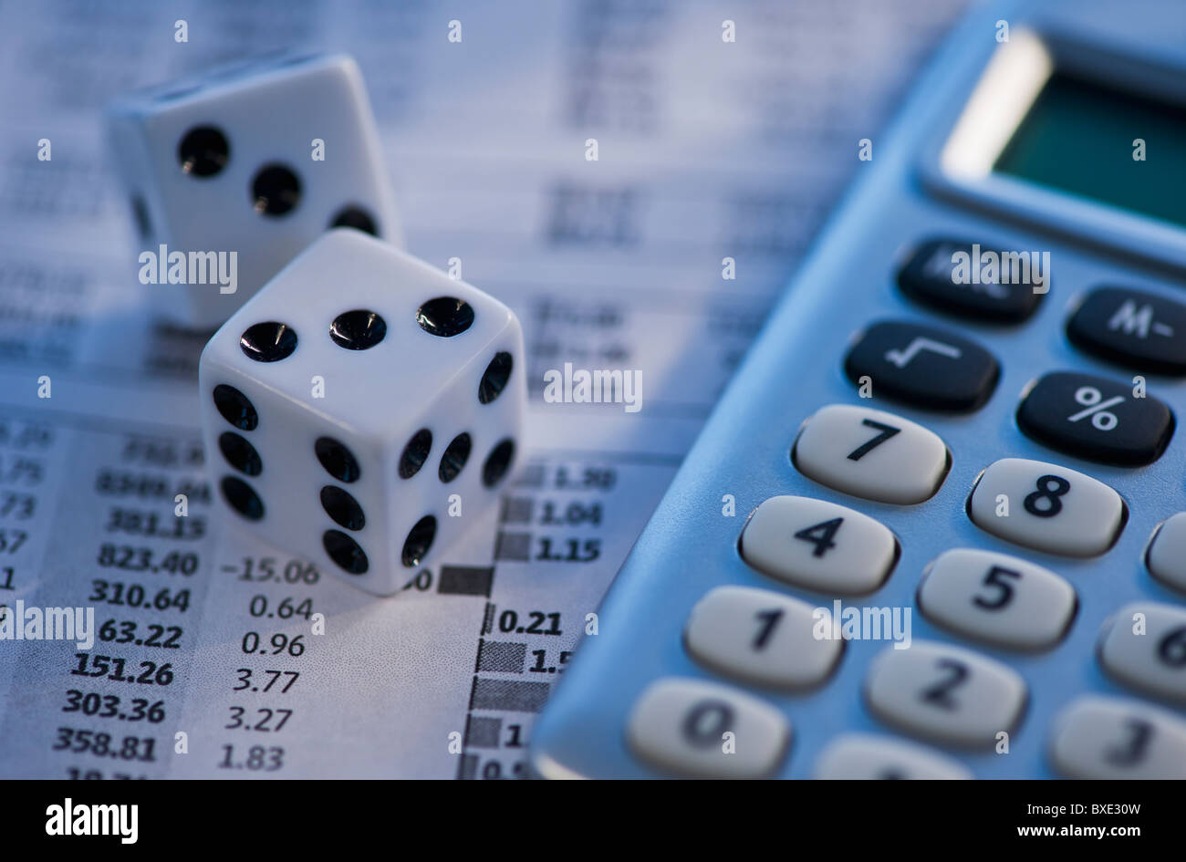 Dice calculator and financial document Stock Photo - Alamy