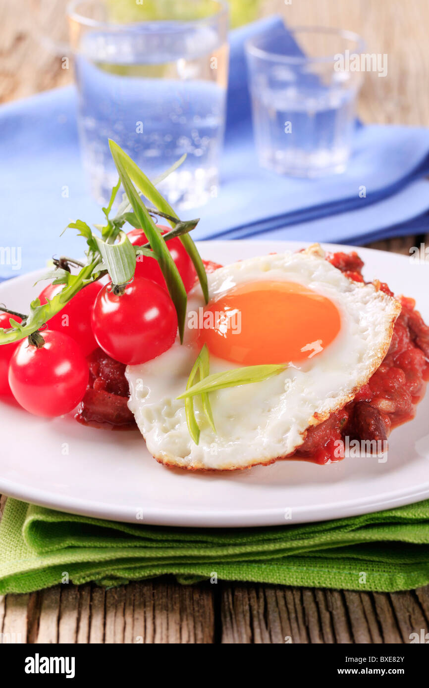 Vegetarian chili and fried egg Stock Photo