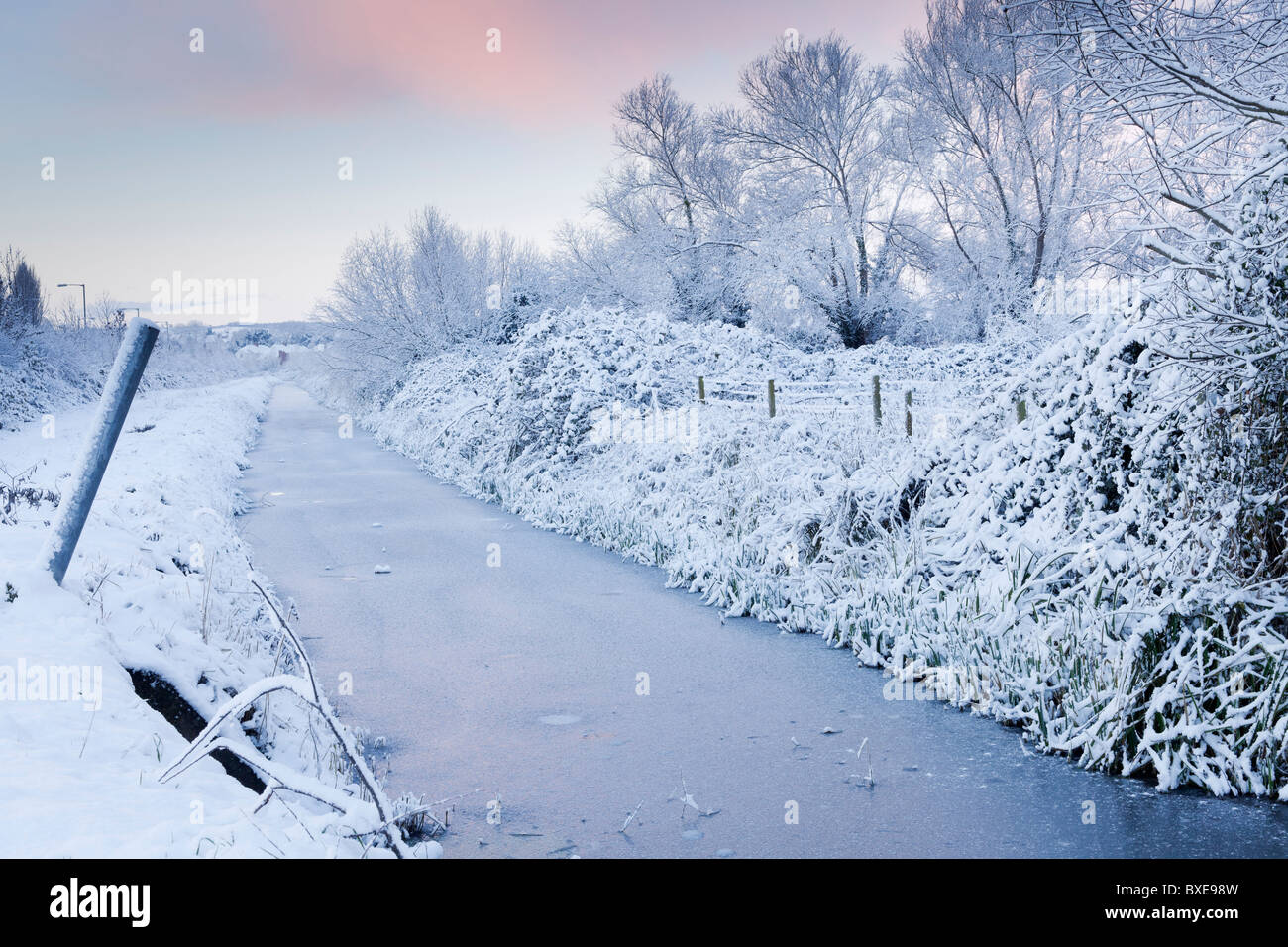 Winter scene of part of Wembdon Rhyne after heavy overnight snow. Stock Photo