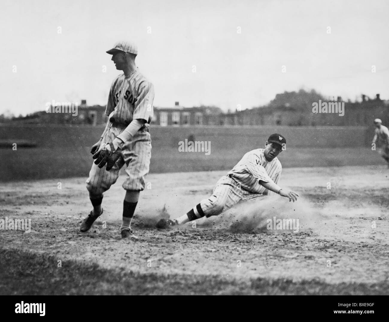 Washington Senators' Bucky Harris sliding into third base, April 1922 Stock Photo