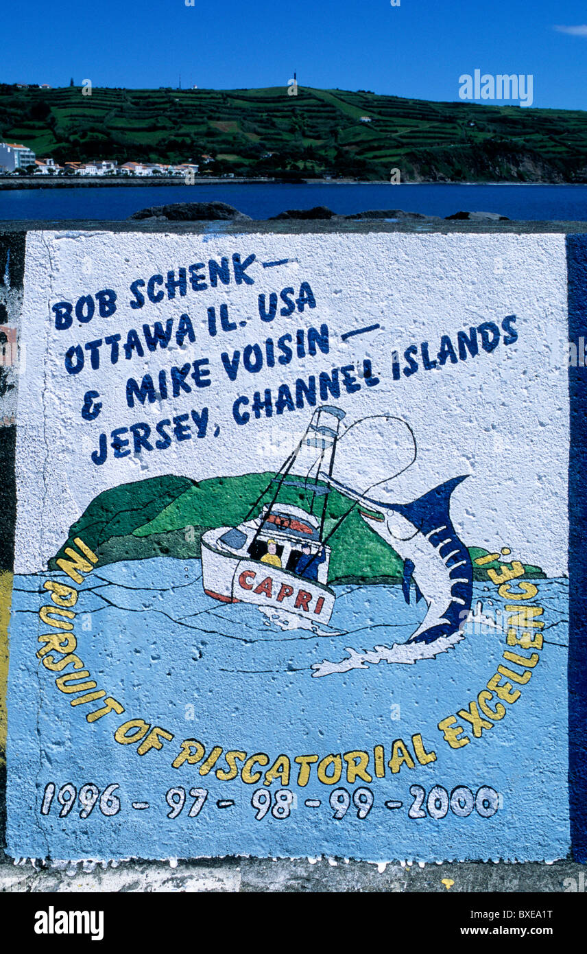 Hand-painted ship's calling cards on the quayside in Horta marina, Faial island, in the Azores Stock Photo