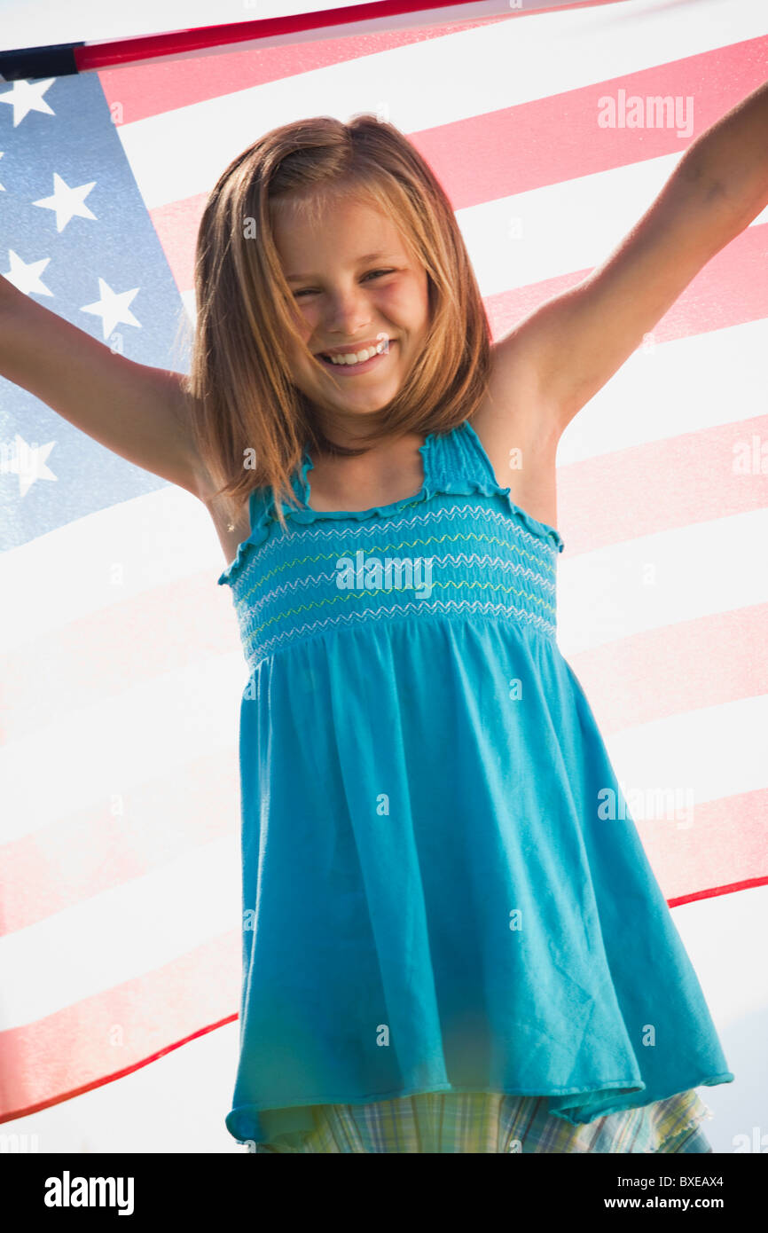 Young girl holding American flag Stock Photo