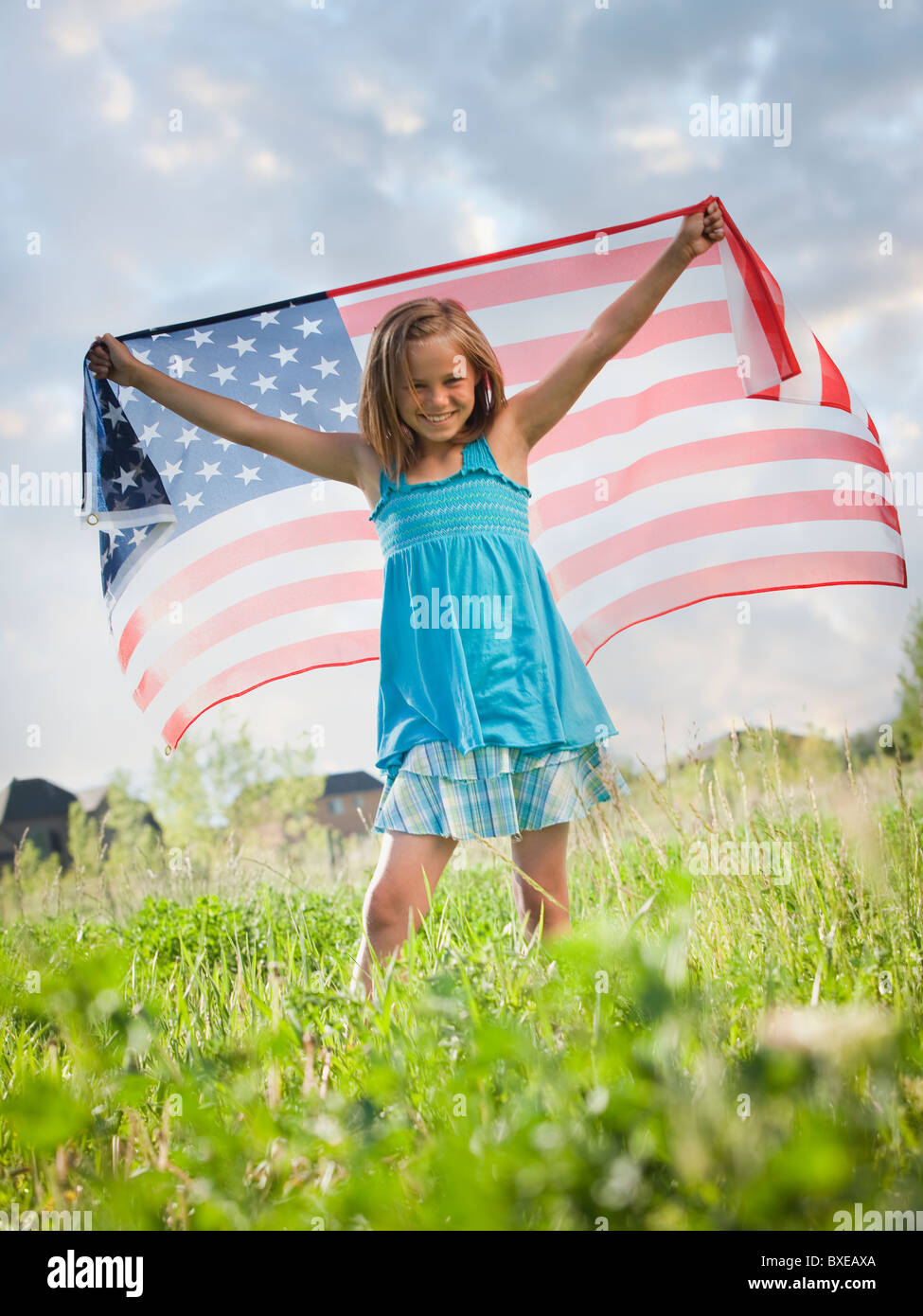 Young girl holding American flag Stock Photo