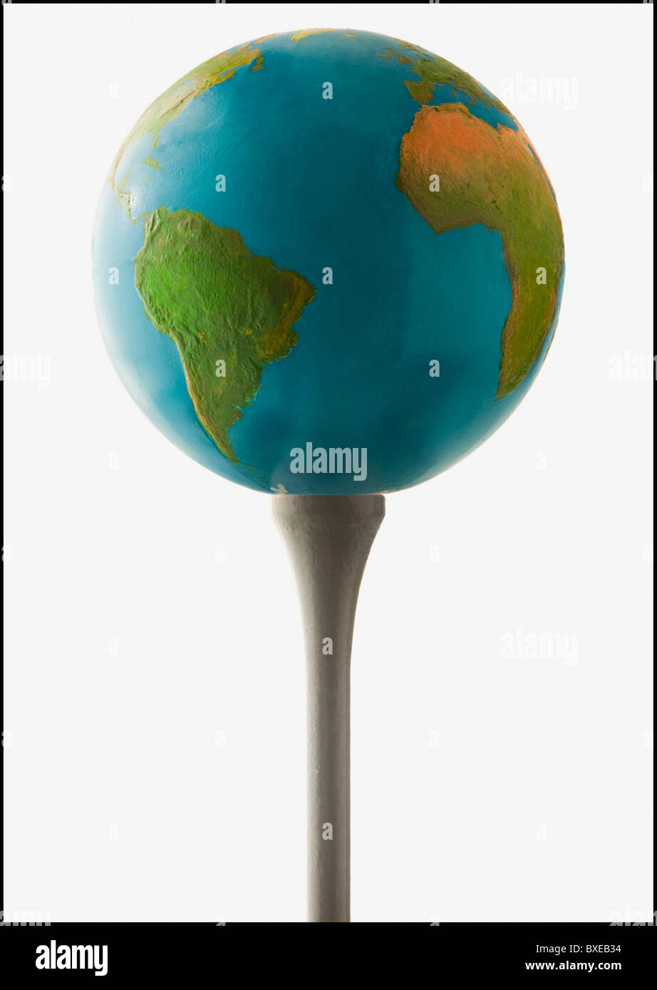 Globe on golf tee Stock Photo Alamy