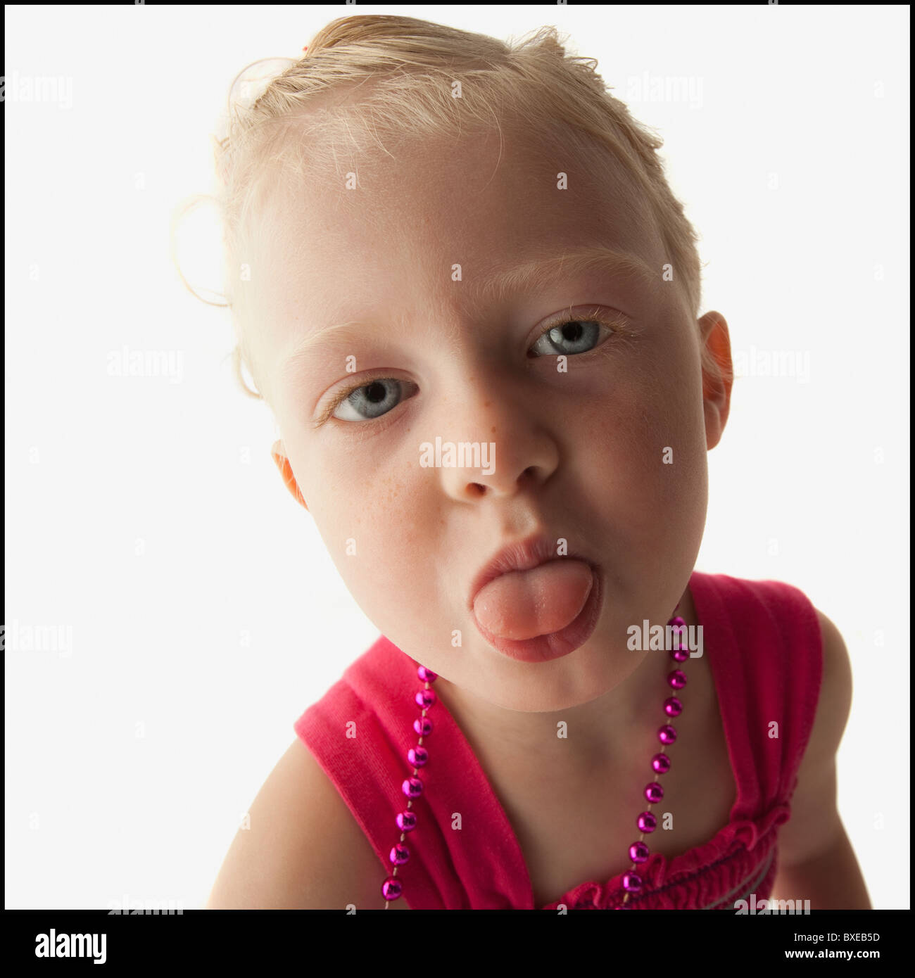 Toddler sticking her tongue out Stock Photo