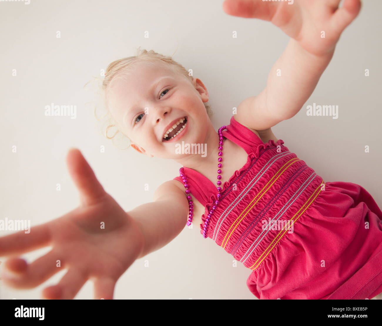 Cute young girl lying down Stock Photo