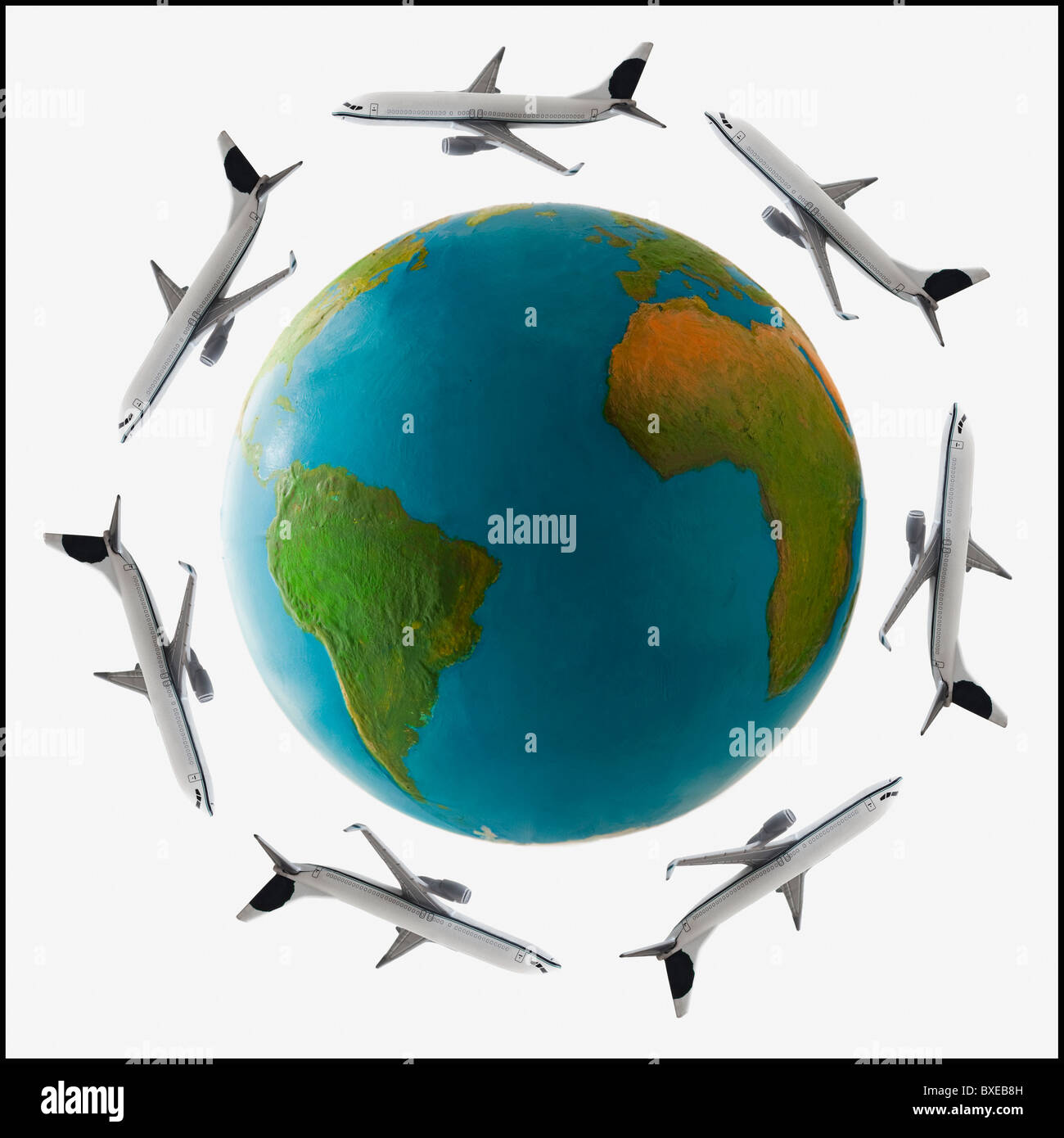 Jets flying around globe Stock Photo