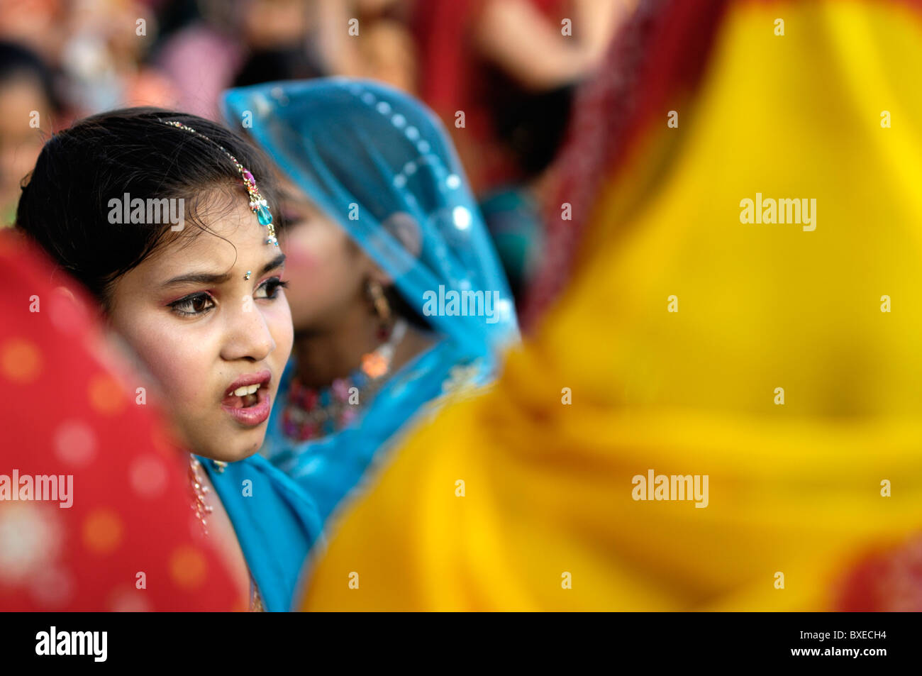 Women celebrate Ganguar by dressing in their best saris and organise traditional dance and music. Stock Photo