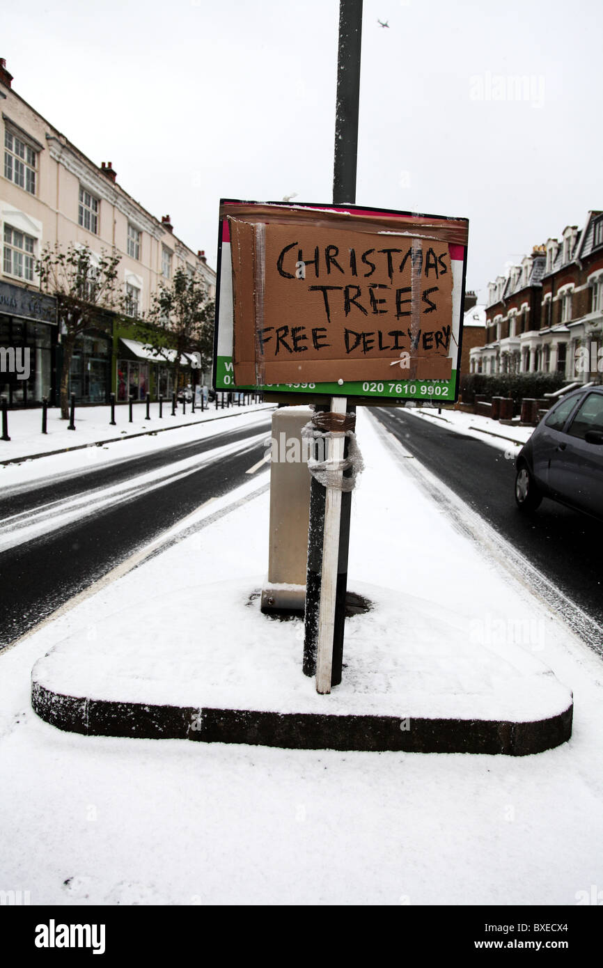 Christmas tree sign. Free delivery. Fulham Road. London Stock Photo Alamy