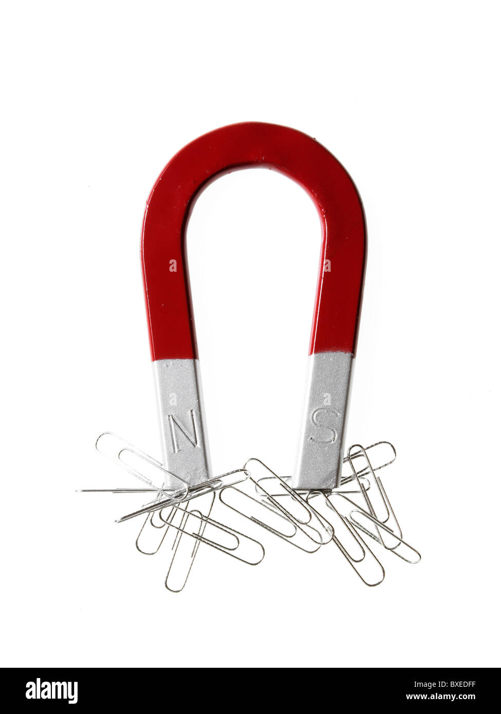 Magnet and paper clips Stock Photo