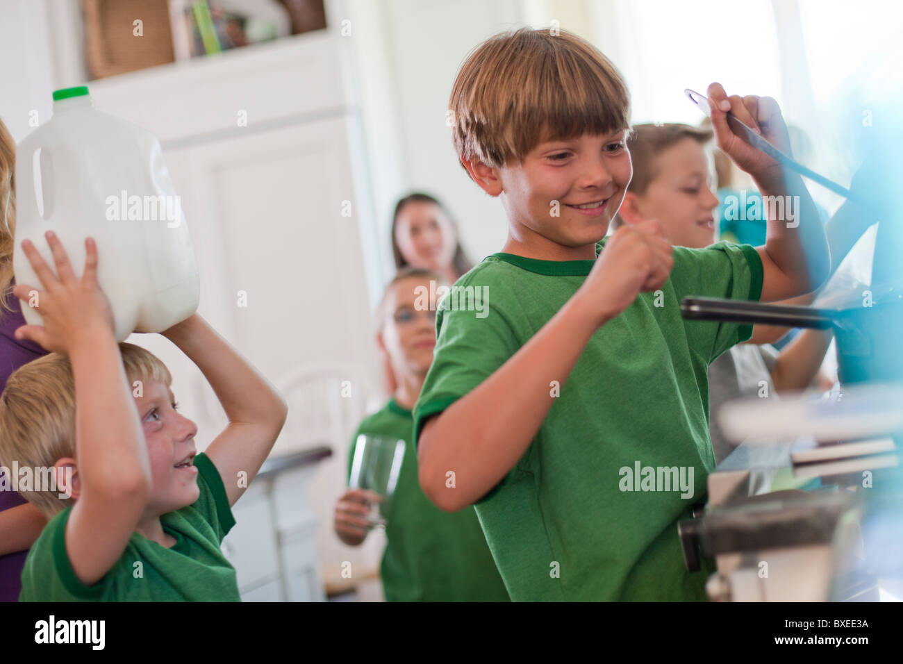 Group of children in kitchen Stock Photo