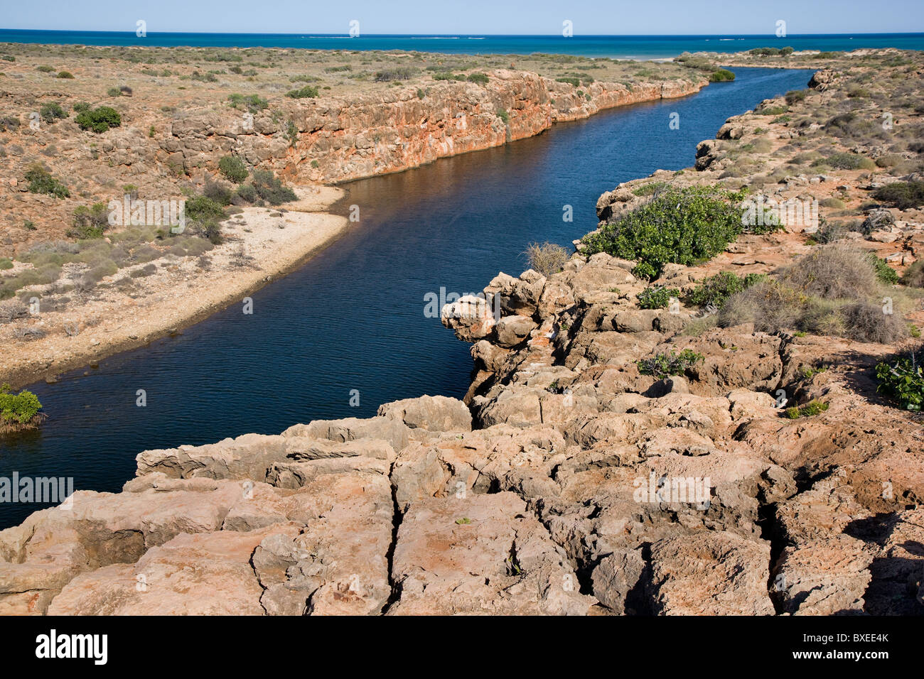 Yardie Creek in the Cape Range National Park near Exmouth is a cool estuary of brackish water in a dry barren bush landscape Stock Photo