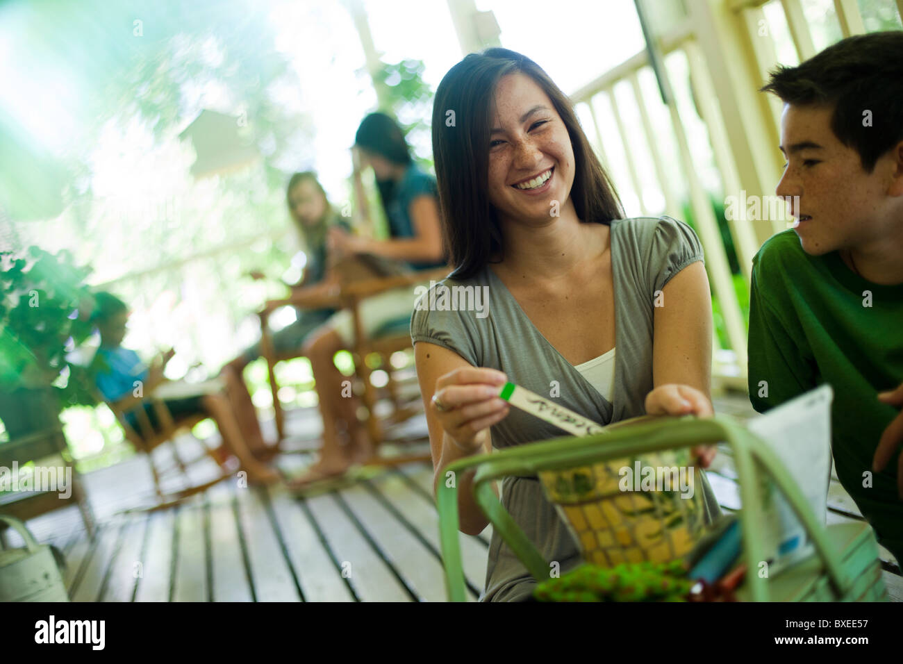 Happy Family Relaxing On Porch High Resolution Stock Photography and ...