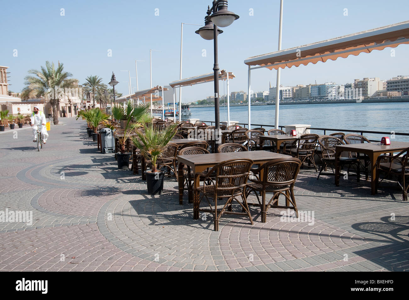 the tables of a bar on the bank of the Creek in Dubai Stock Photo Alamy