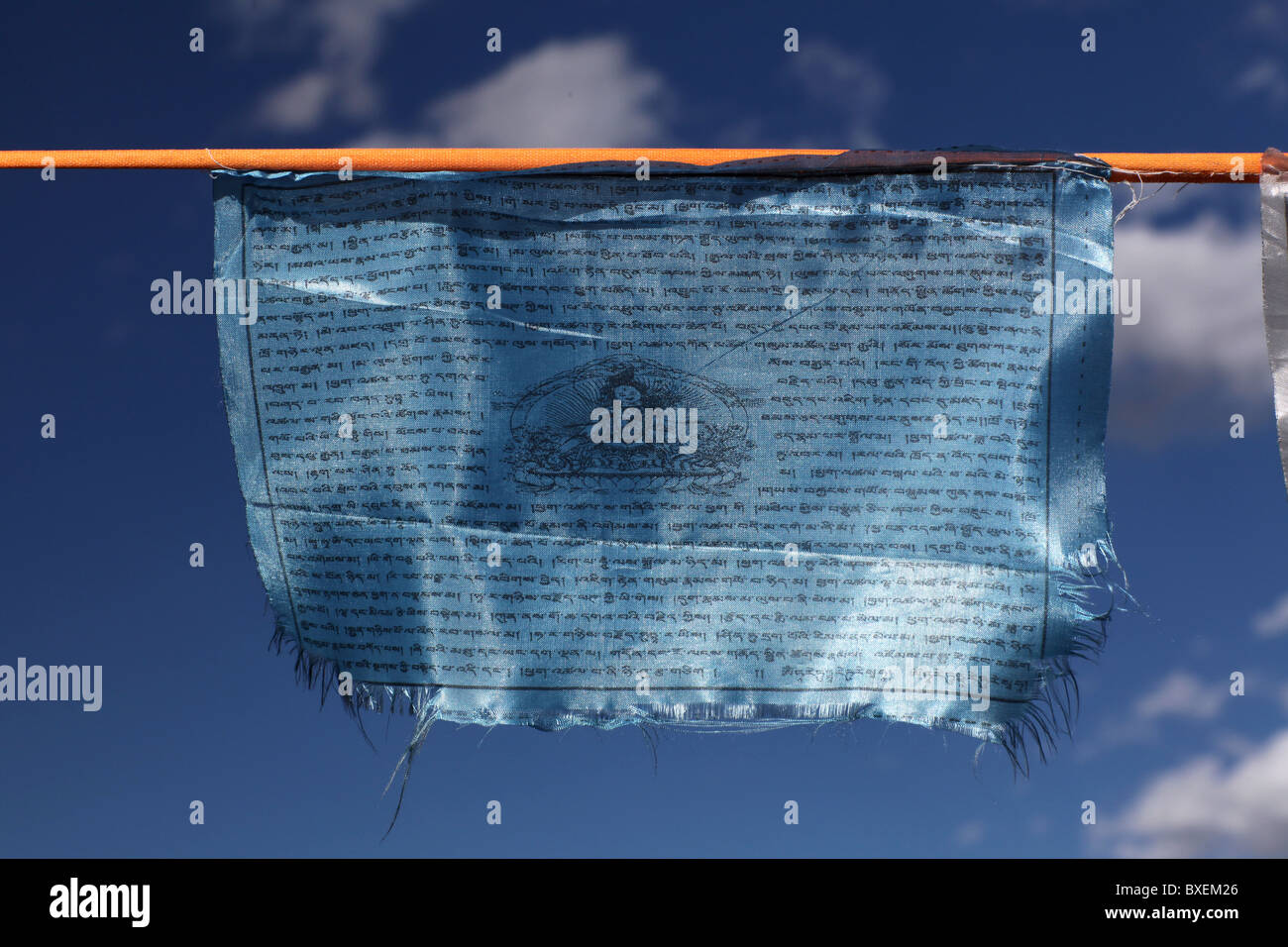 A blue prayer flag in Tagong town centre, Sichuan province, China. Stock Photo