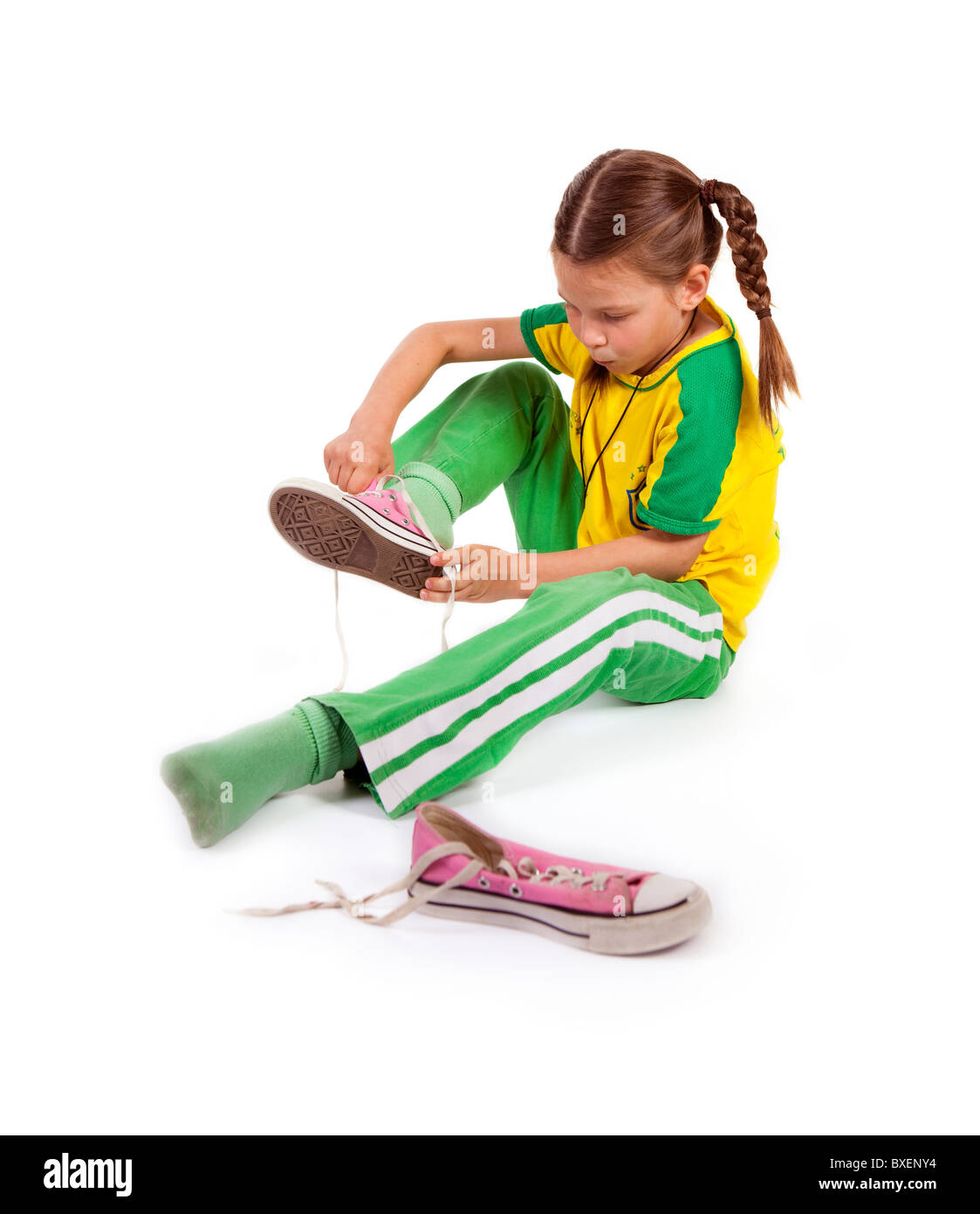 girl puts sport shoes on Stock Photo