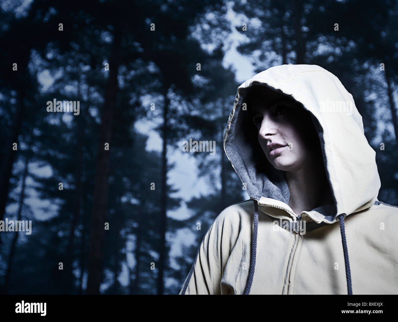 Hooded Woman in Woods Stock Photo