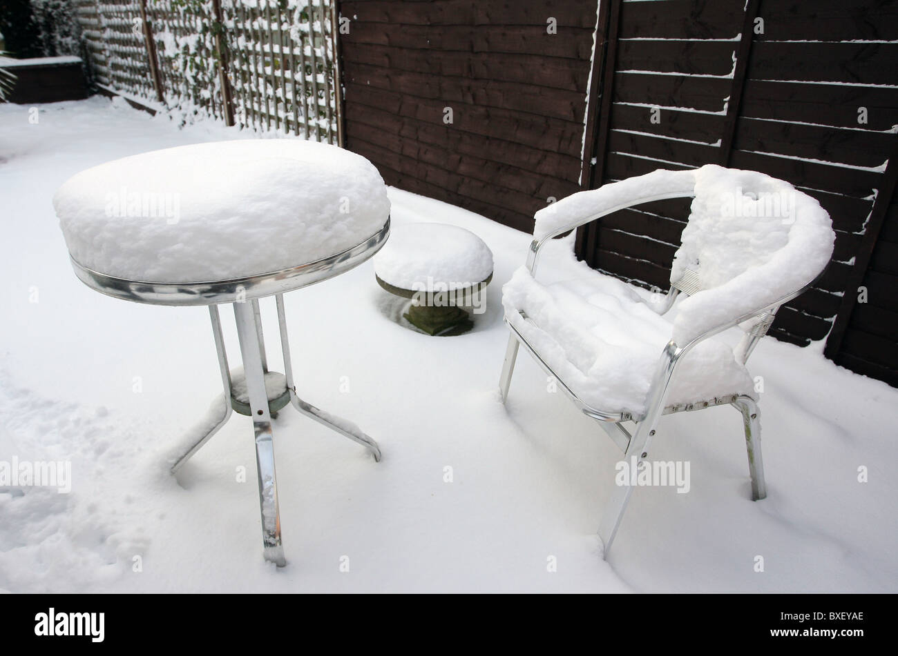Garden patio furniture under thick snow Stock Photo Alamy