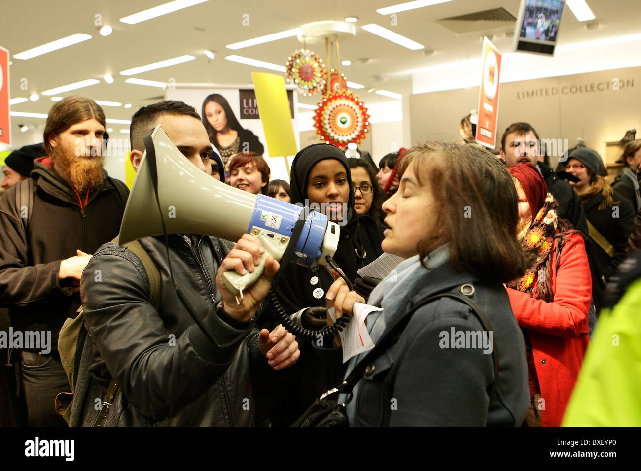 Female shopper voices her support for protesters at M&S Store Oxford Street London Stock Photo
