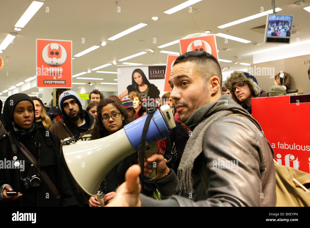 UKUncut demonstrator with a megaphone in M&S store protest Oxford Street London Stock Photo
