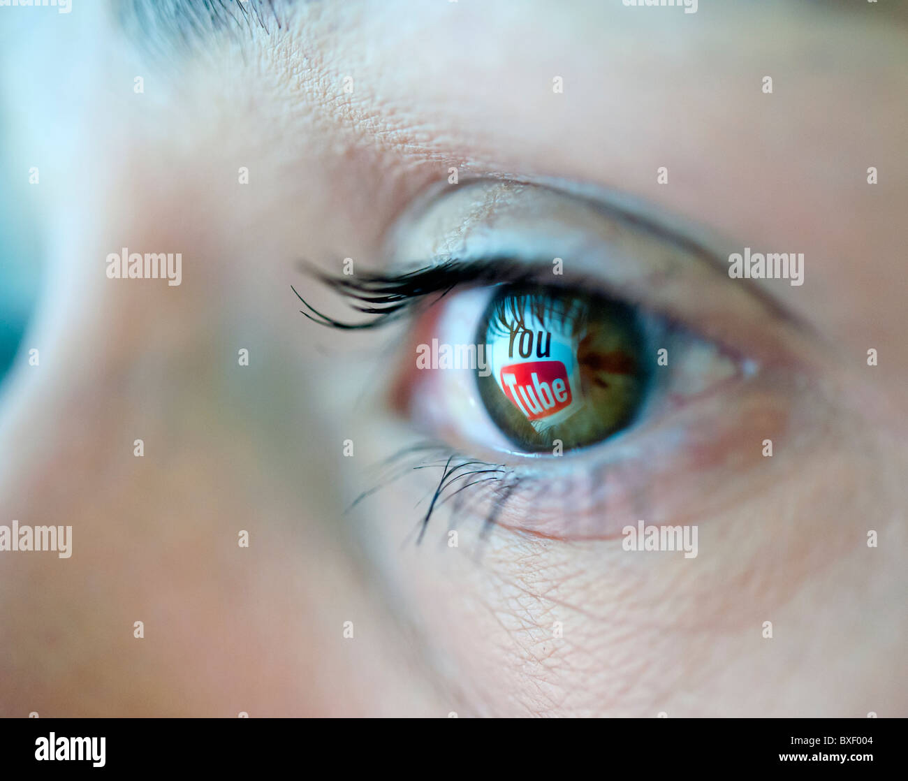 Logo from Youtube video sharing website reflected in an eye Stock Photo