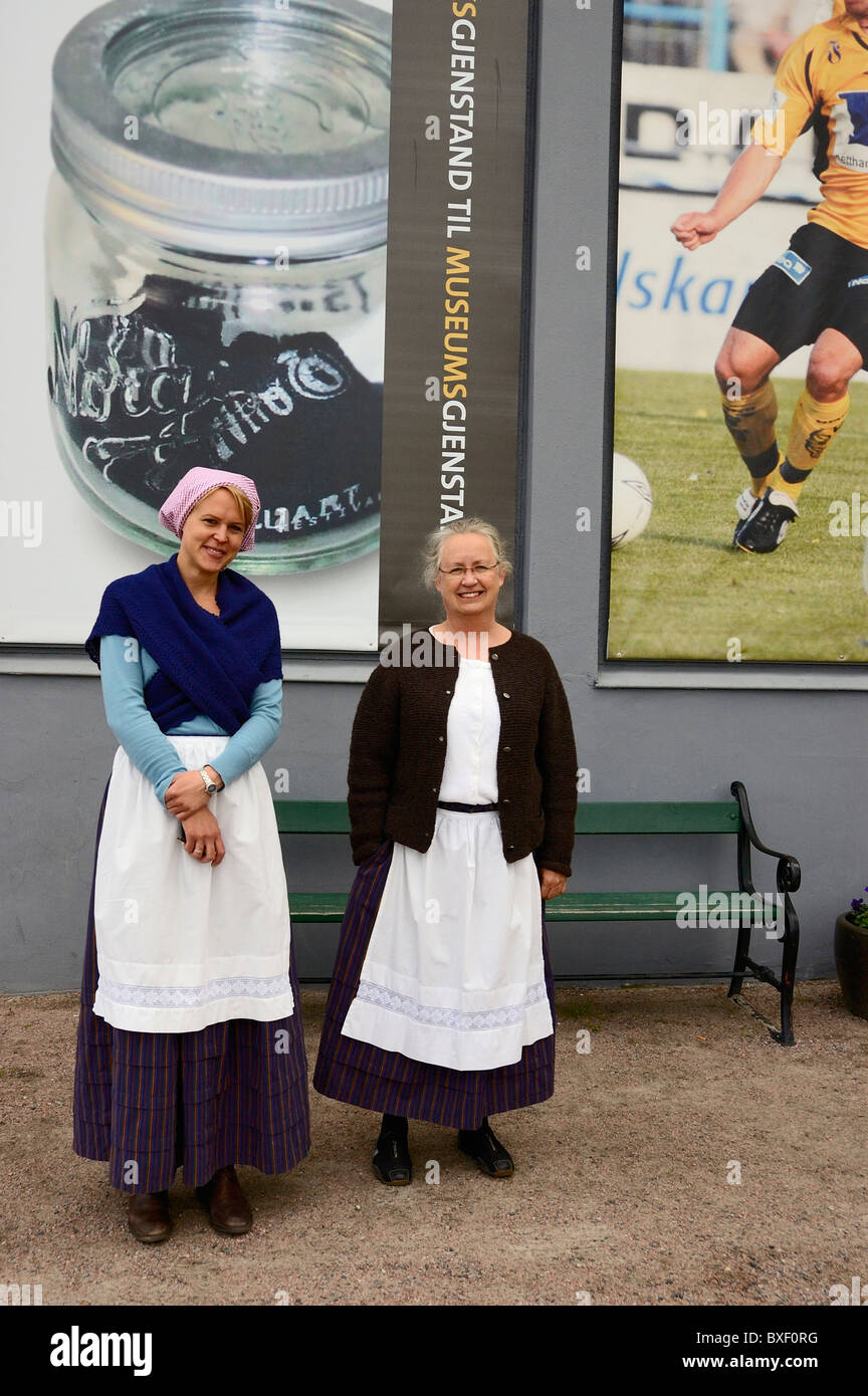 The Curator and a Guide wearing Norwegian national dress at the Vest-Agder County Folk Museum, Kristiansand, Norway Stock Photo