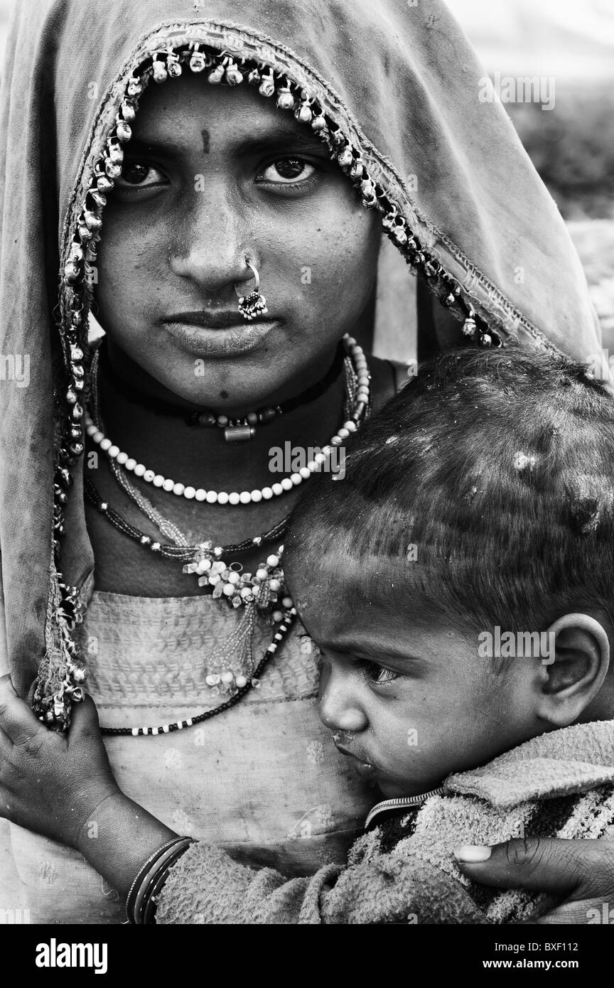Gadia Lohar. Nomadic Rajasthan woman and baby boy. India's wandering blacksmiths. India. Monochrome Stock Photo