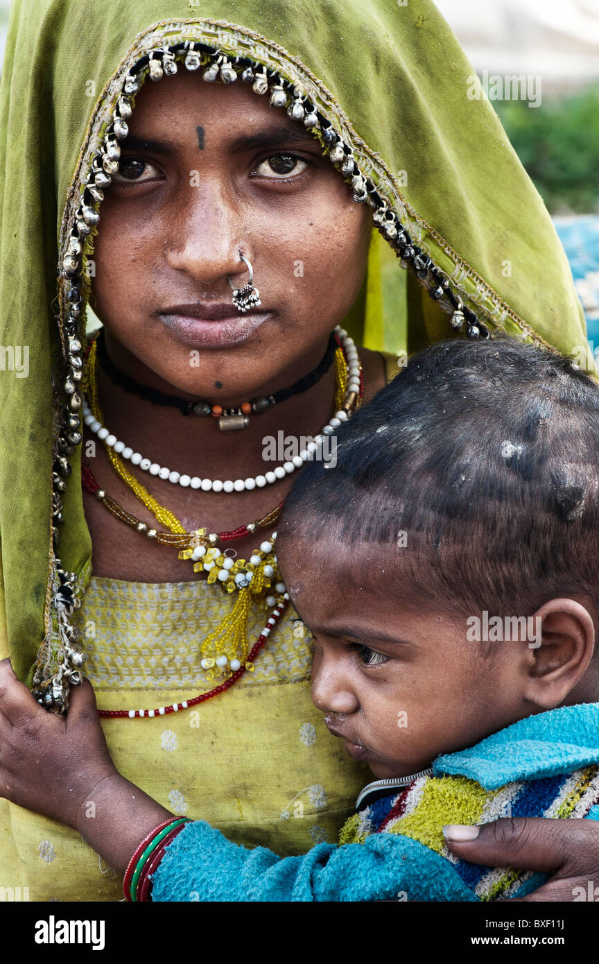 Gadia Lohar. Nomadic Rajasthan woman and baby boy. India's wandering blacksmiths. India Stock Photo