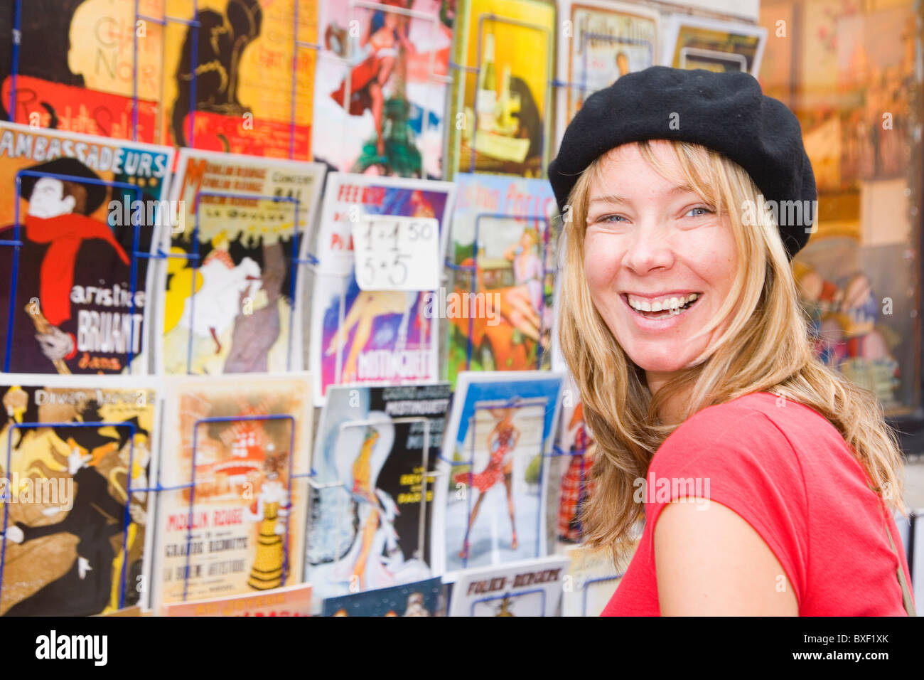 Smiling woman in a beret in Montmartre, Paris Stock Photo - Alamy