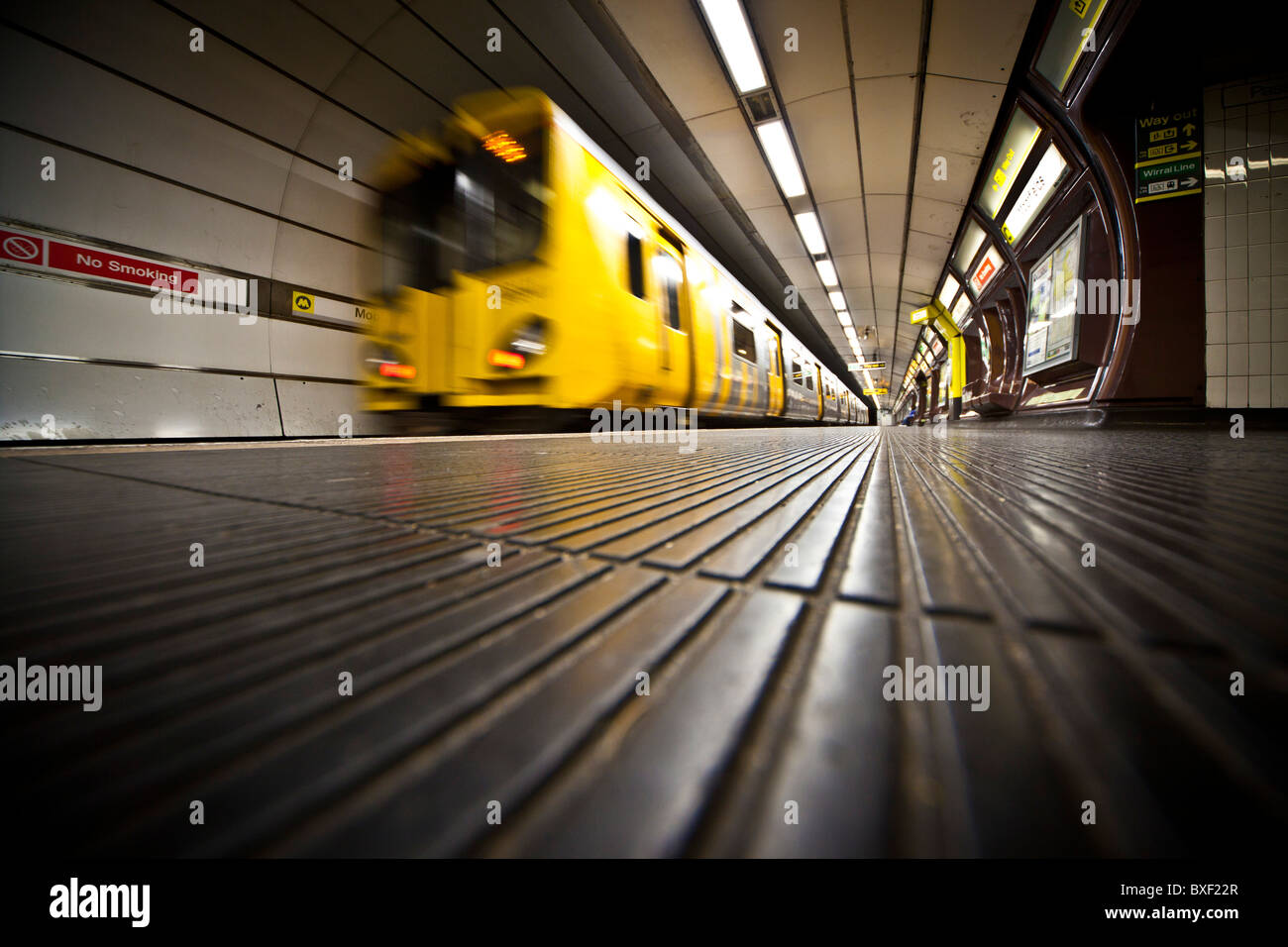 Train pulling out of railway station Stock Photo Alamy