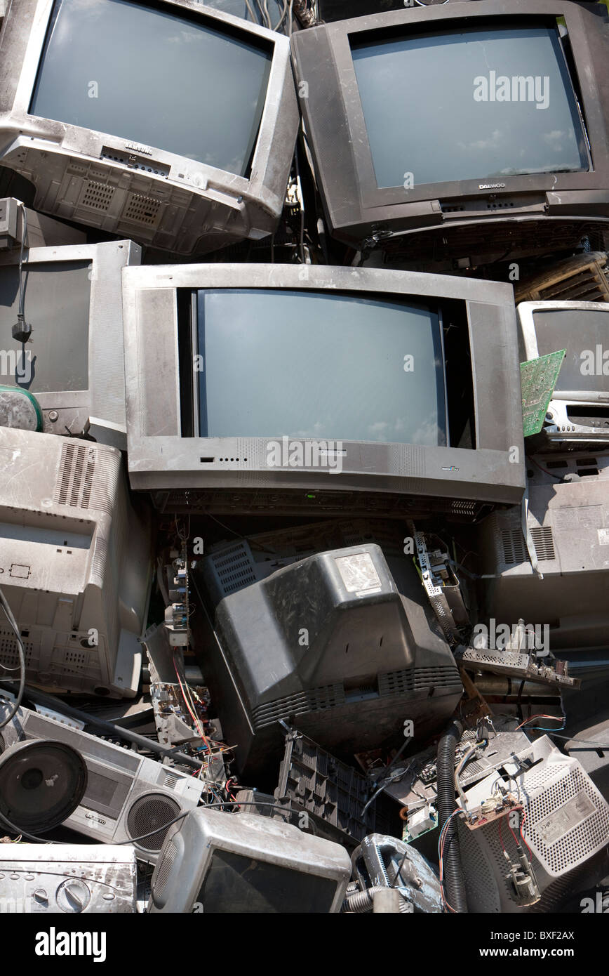 Broken Televisions and computer Monitors ready for recycling, UK Stock Photo