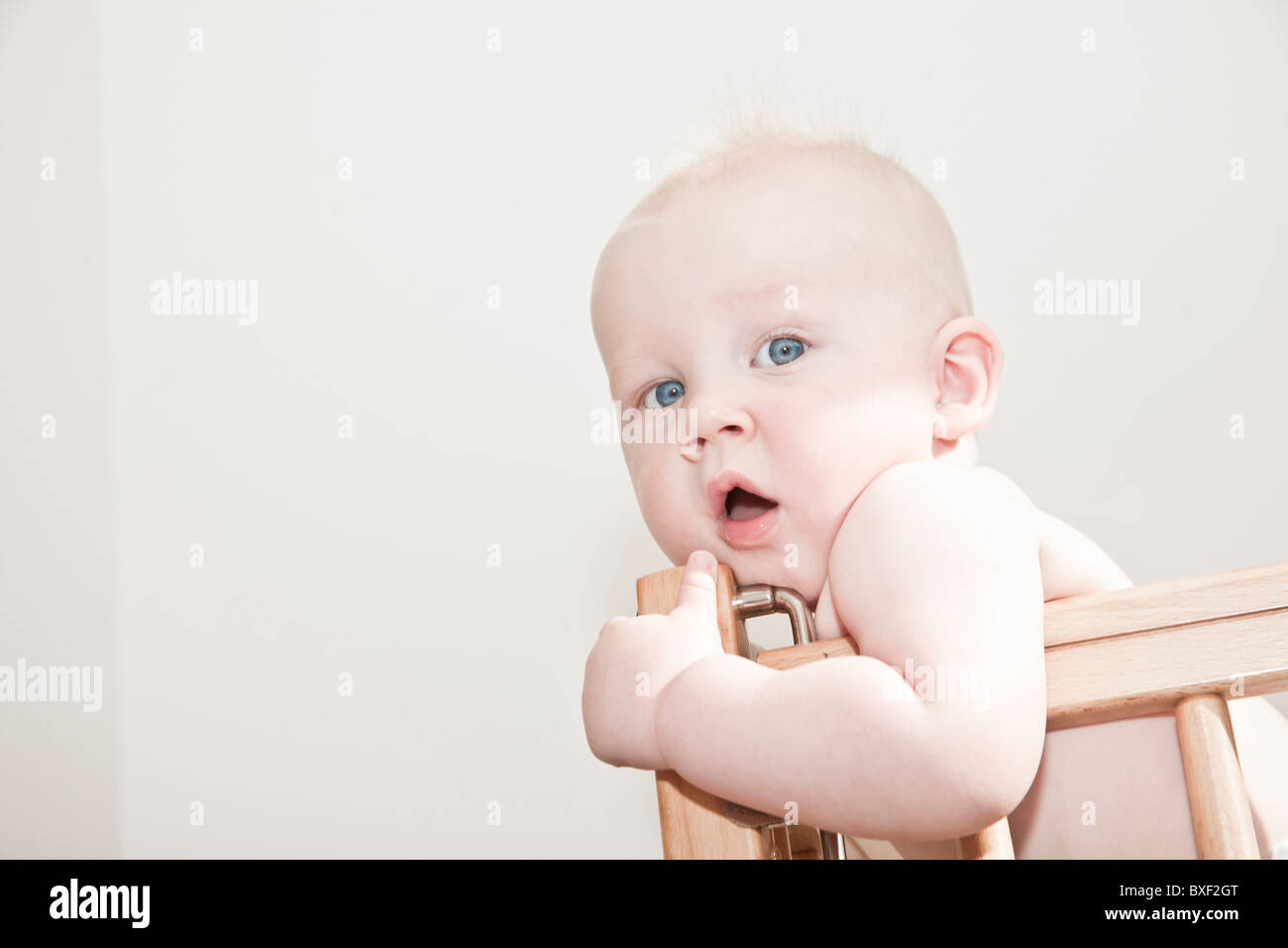 baby in a cot Stock Photo Alamy