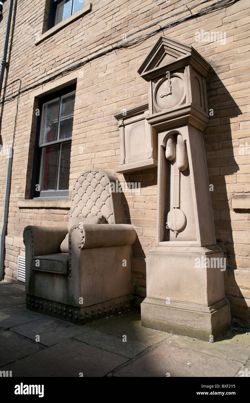 Stone Chair and Grandfather clock in Little Germany, Bradford. Stock Photo