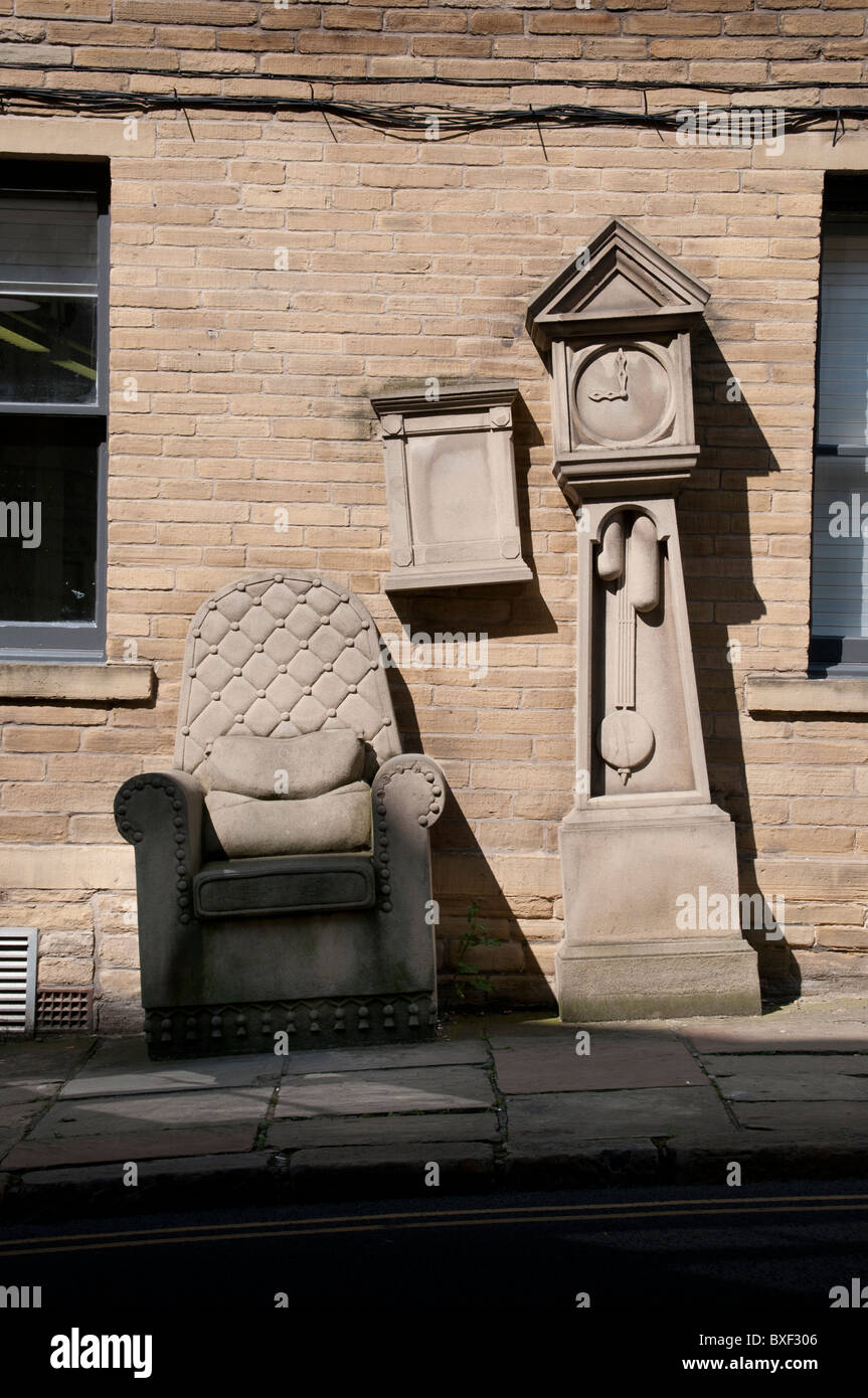 Stone Chair and Grandfather clock in Little Germany, Bradford. Stock Photo