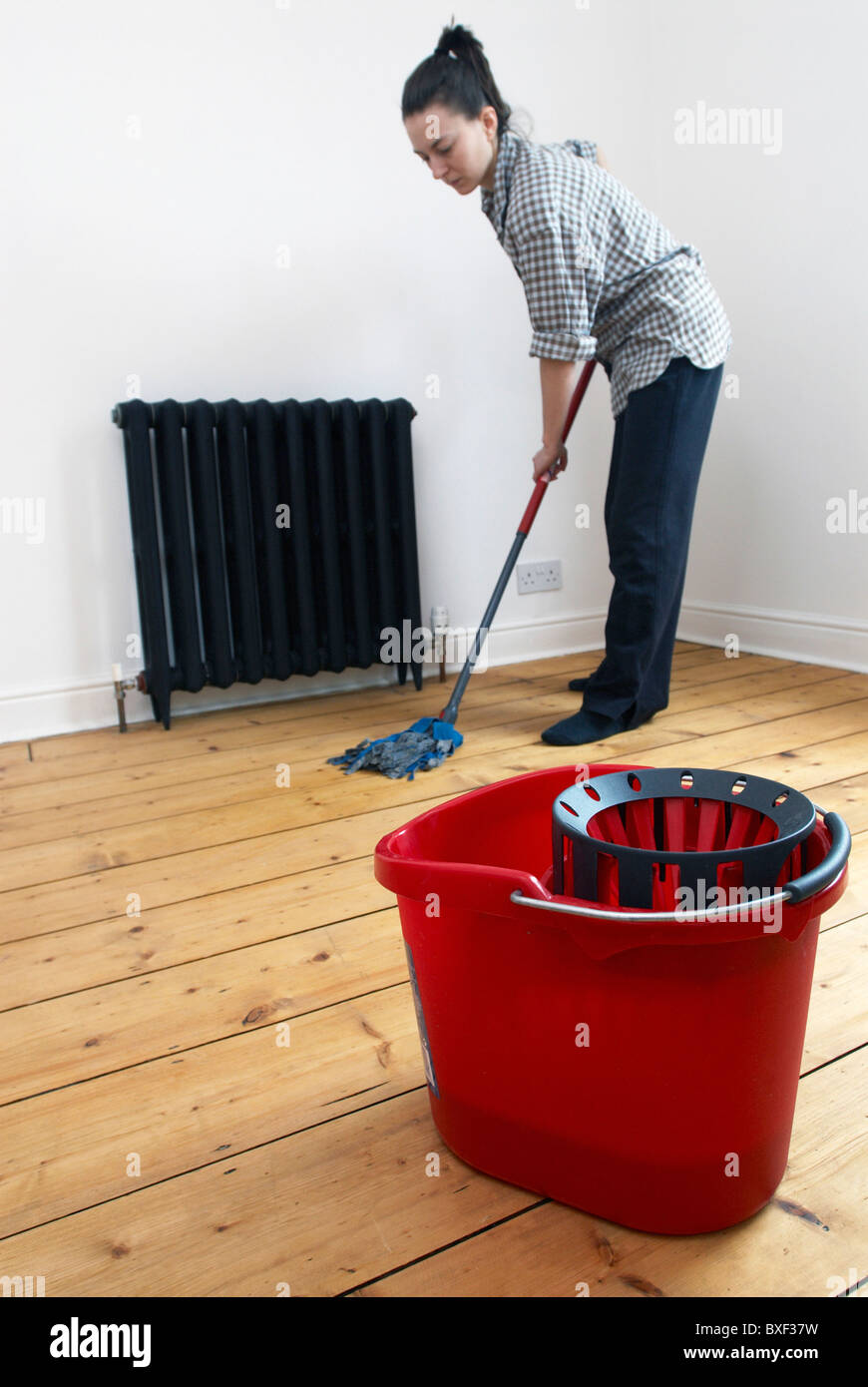 Woman mopping wooden floor Stock Photo Alamy