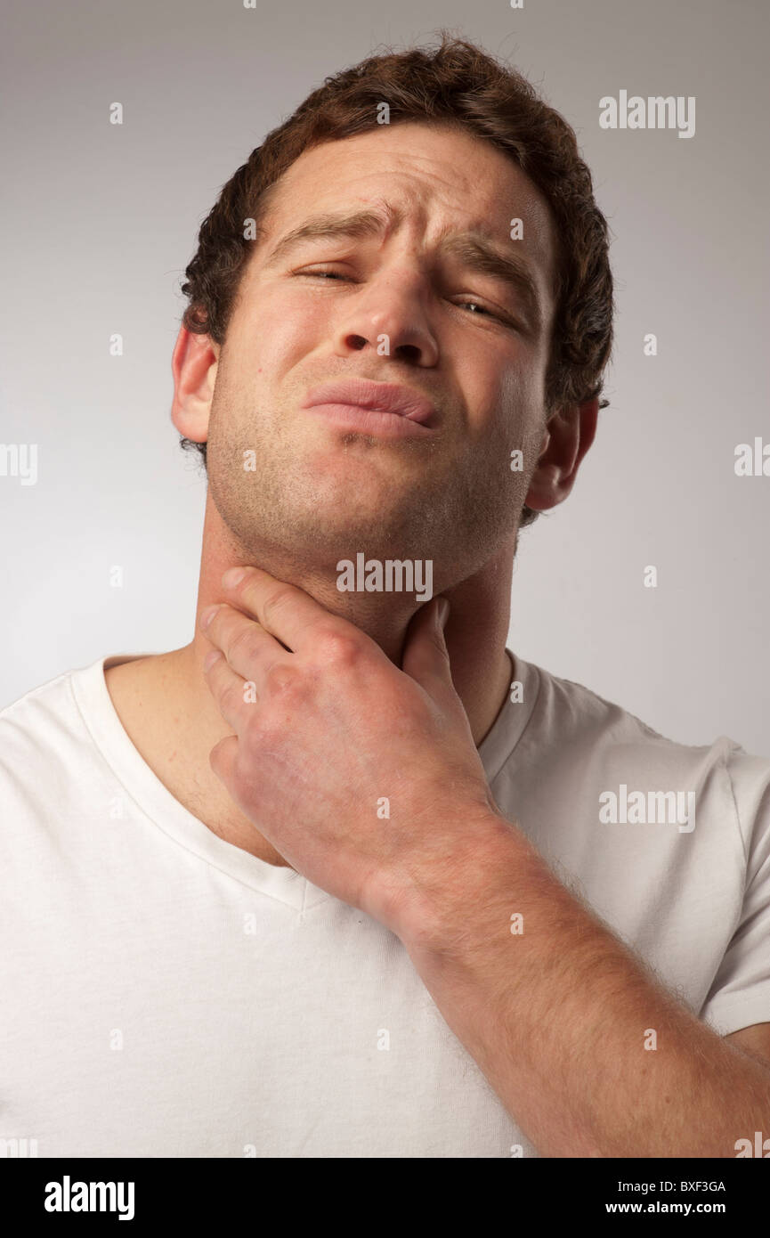 white caucasian male man suffering with a sore throat neck laryngitis