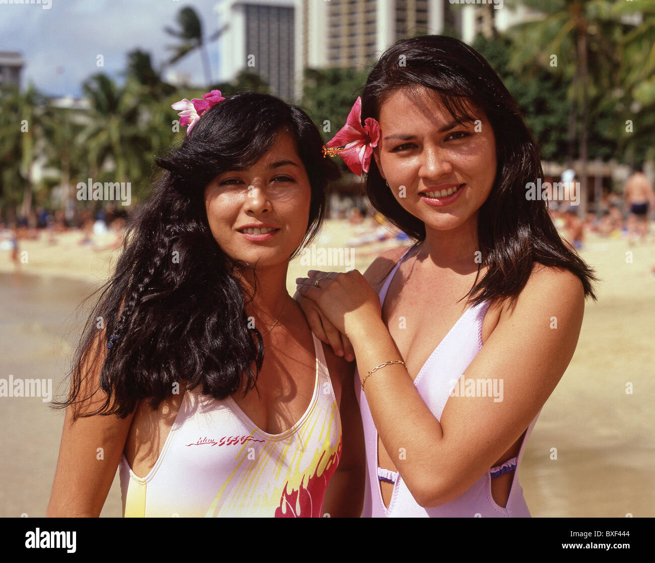 Young Hawaiian women on Waikiki Beach, Honolulu, Oahu, Hawaii, United States of America Stock Photo