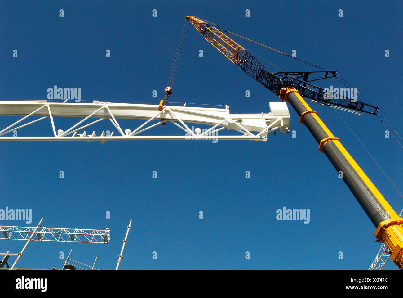 Crane lifting roof truss on hires stock photography and images Alamy