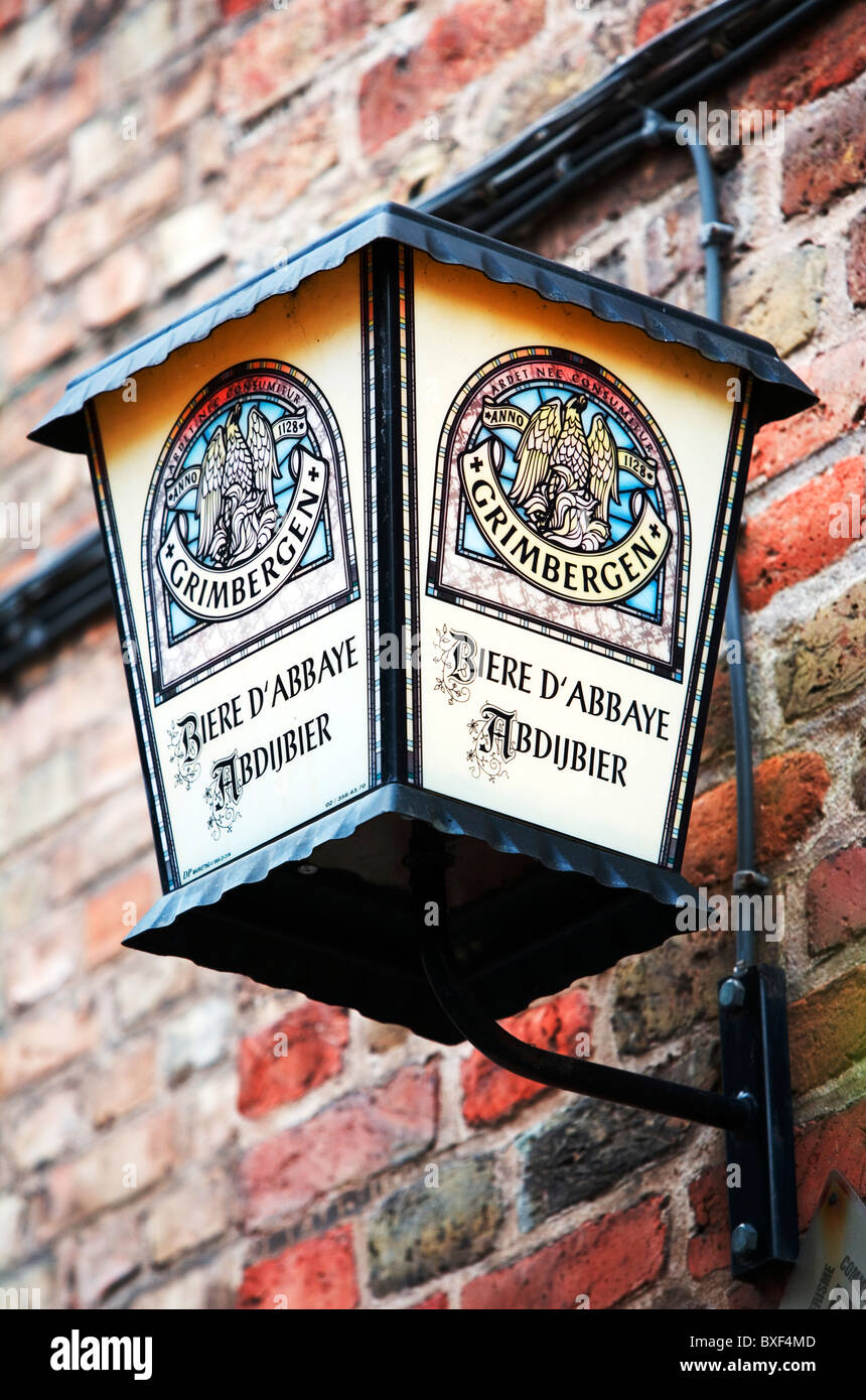 Street lamp advertising beer, Bruges, Belgium, Europe Stock Photo