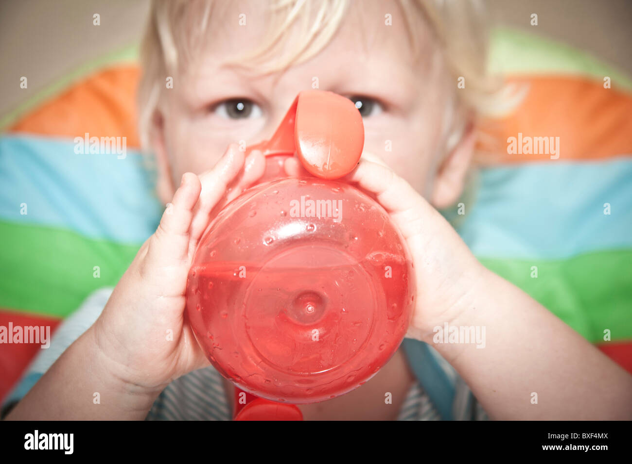 https://c8.alamy.com/comp/BXF4MX/child-drinking-from-a-toddler-drinking-cup-BXF4MX.jpg
