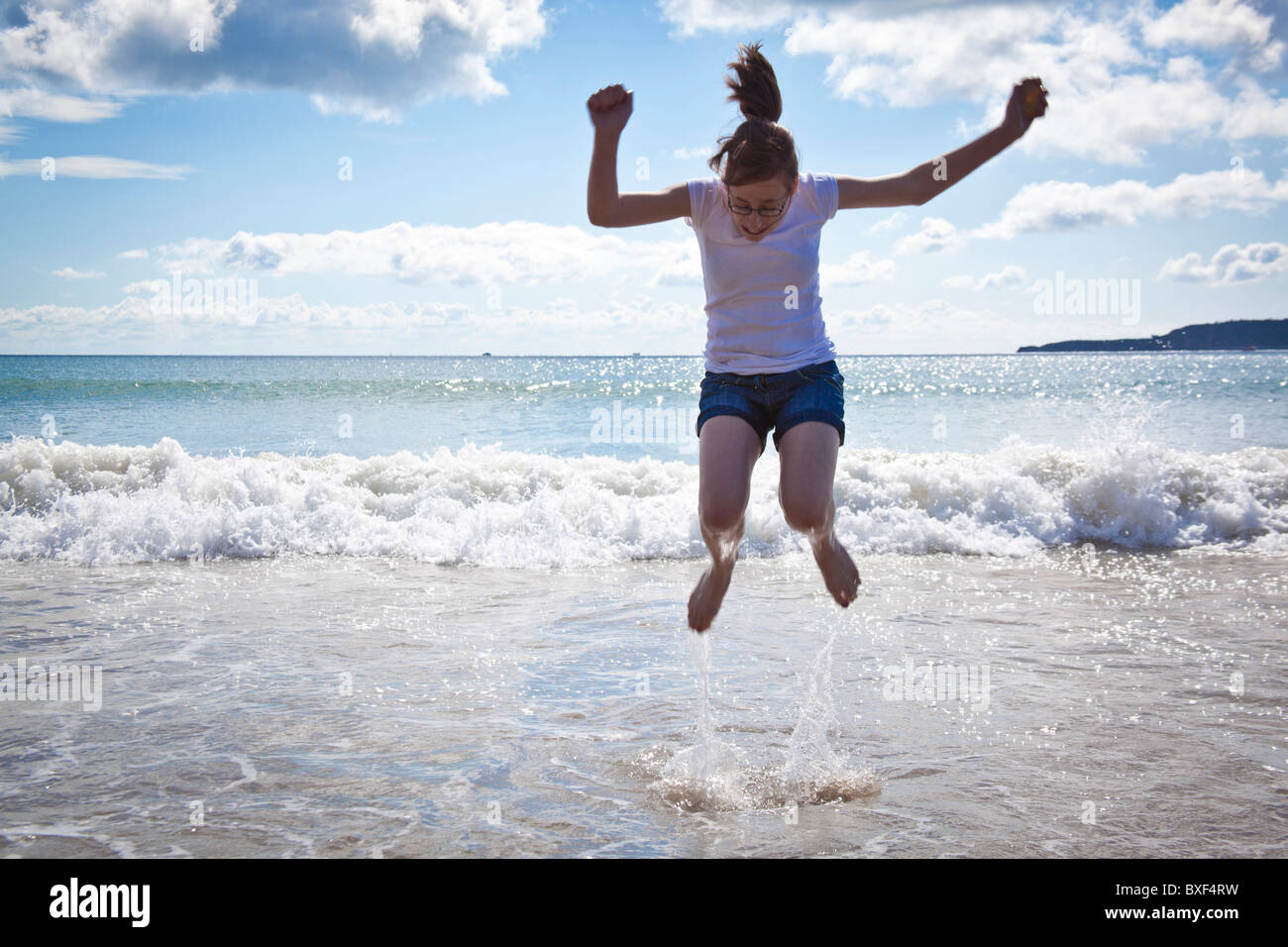Girl Jumping In The Sea High Resolution Stock Photography and Images ...