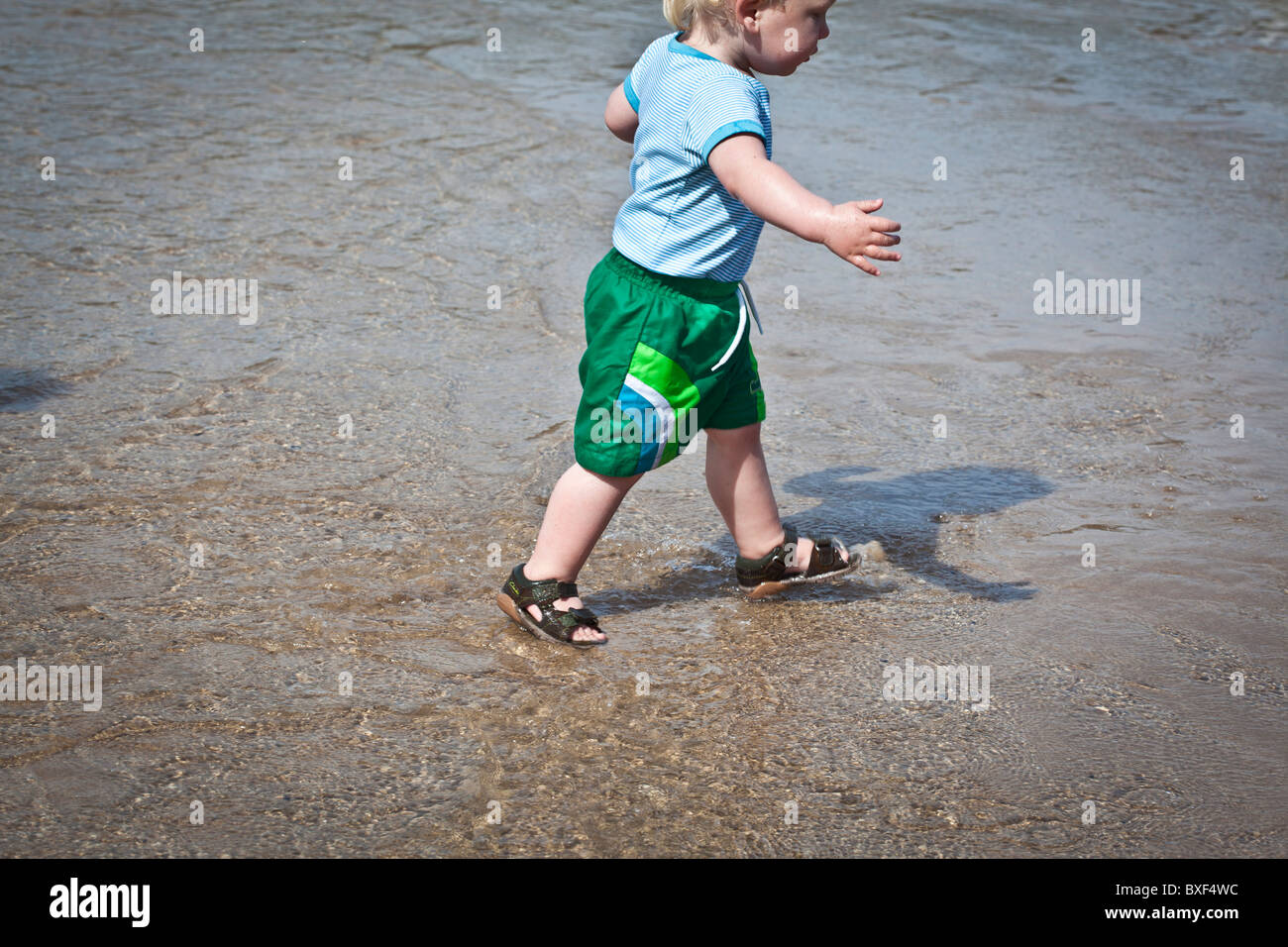 Child paddling in the sea Stock Photo
