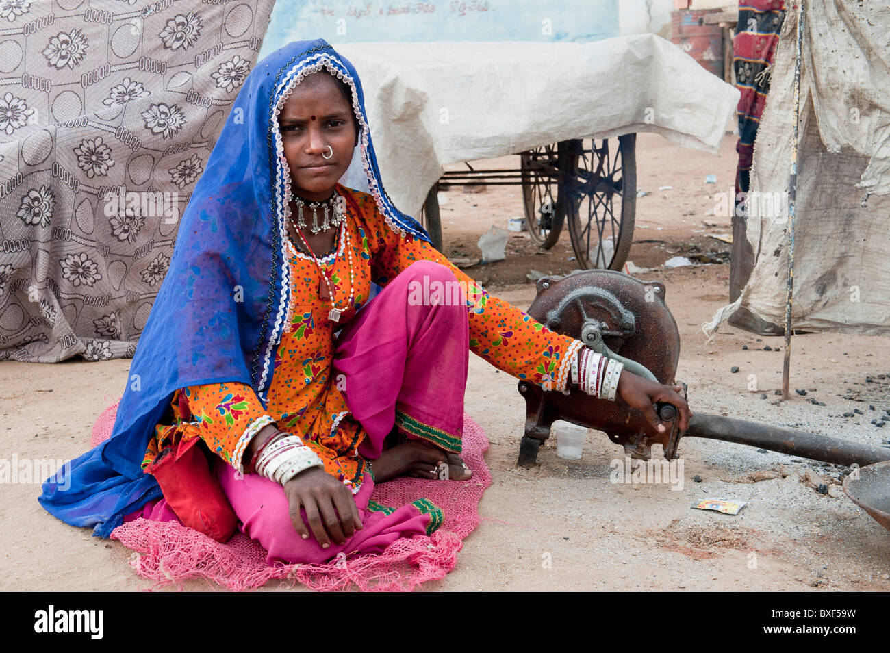 Gadia Lohar. Nomadic Rajasthan young woman tending a furnace. India's wandering blacksmiths. India Stock Photo