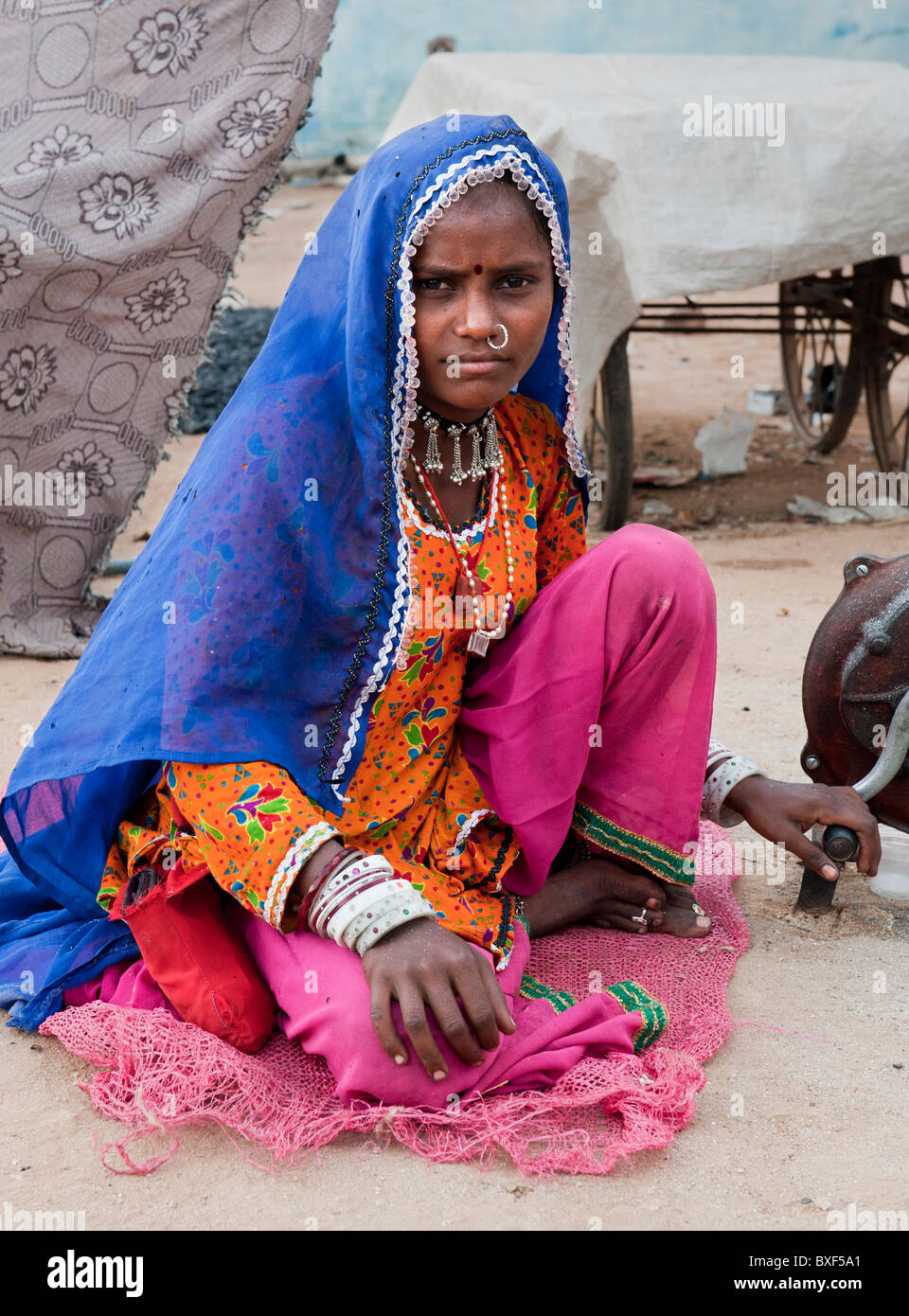 Gadia Lohar. Nomadic Rajasthan young woman tending a furnace. India's wandering blacksmiths. India Stock Photo