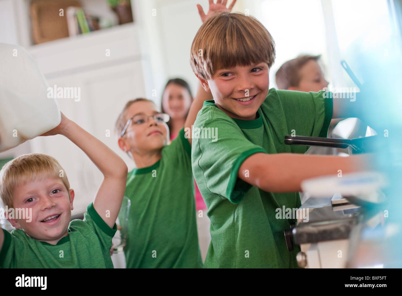 Group of children in kitchen Stock Photo